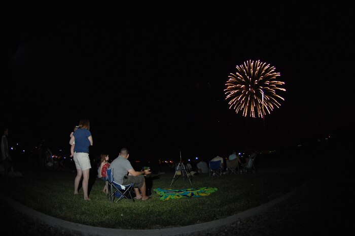 Family members observe the fireworks show during the Freedom fest event at Freedom park July 4, 2008 Nellis Air Force Base, Nev.
(U.S. Air Force Photo by Senior Airman Larry E. Reid Jr.)