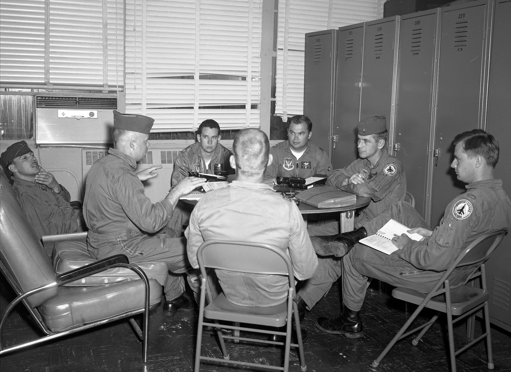 LT Warren Brown pictured 2nd from the right in a pilot briefing. May 14, 1968 
On 14 July 1968, 1st Lt Warren K. Brown was on an air strike mission in the AShau Valley. (Vietnam) As he made his pass over the target area, his aircraft was hit by ground fire. He headed in an easterly direction and bailed out shortly afterwards as his aircraft was on fire. During the ejection, there was a chute entanglement and the pilot was found deceased in his chute harness by a helicopter crew.
The above paragraph is how the death of Sioux City native Lieutenant Warren Brown is recorded in the history books. Brown was the only pilot of the Sioux City based 185th Air National Guard to be killed in Vietnam. (The 185th Tactical Fighter Group was mobilized on January 26, 1968 and returned to Sioux City on the 14th of May 1969.)
