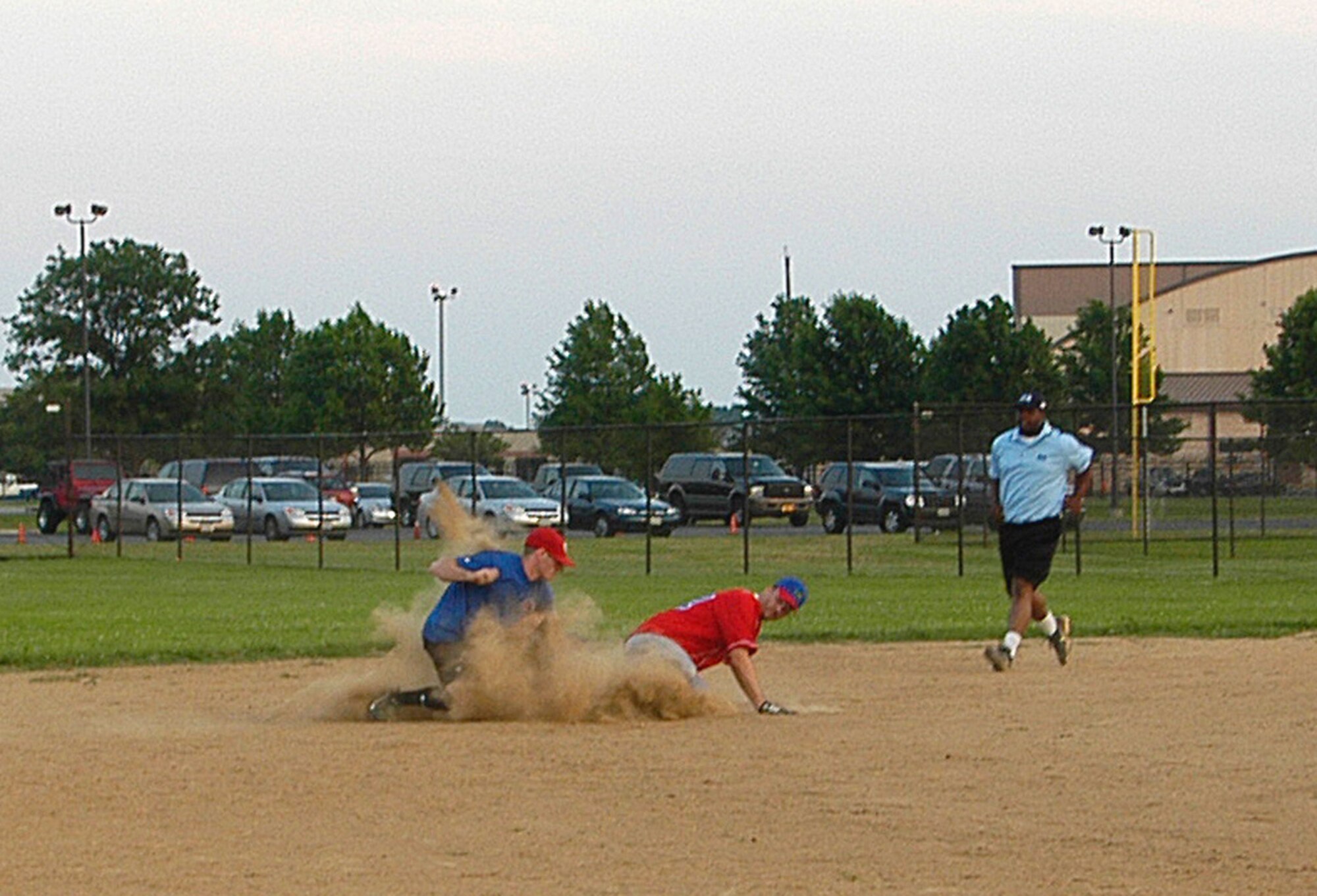 AFOSI Gators’ catcher Dave Chesher slides safely into second after legging out a double. The Gators took two from the 89th Operations Group, 23-9 and 12-6 respectively, to up their record to 6-0. (U.S. Air Force photo/Tech. Sgt. John Jung)