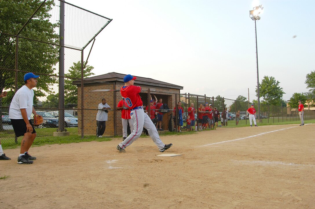 AFOSI Gators’ shortstop Joseph Kasper sends a frozen rope triple to left field. Kasper drove in three RBIs with the extra base hit. The Gators went onto victory 23-9 in the first game of a doubleheader. (U.S. Air Force photo/Tech. Sgt. John Jung)