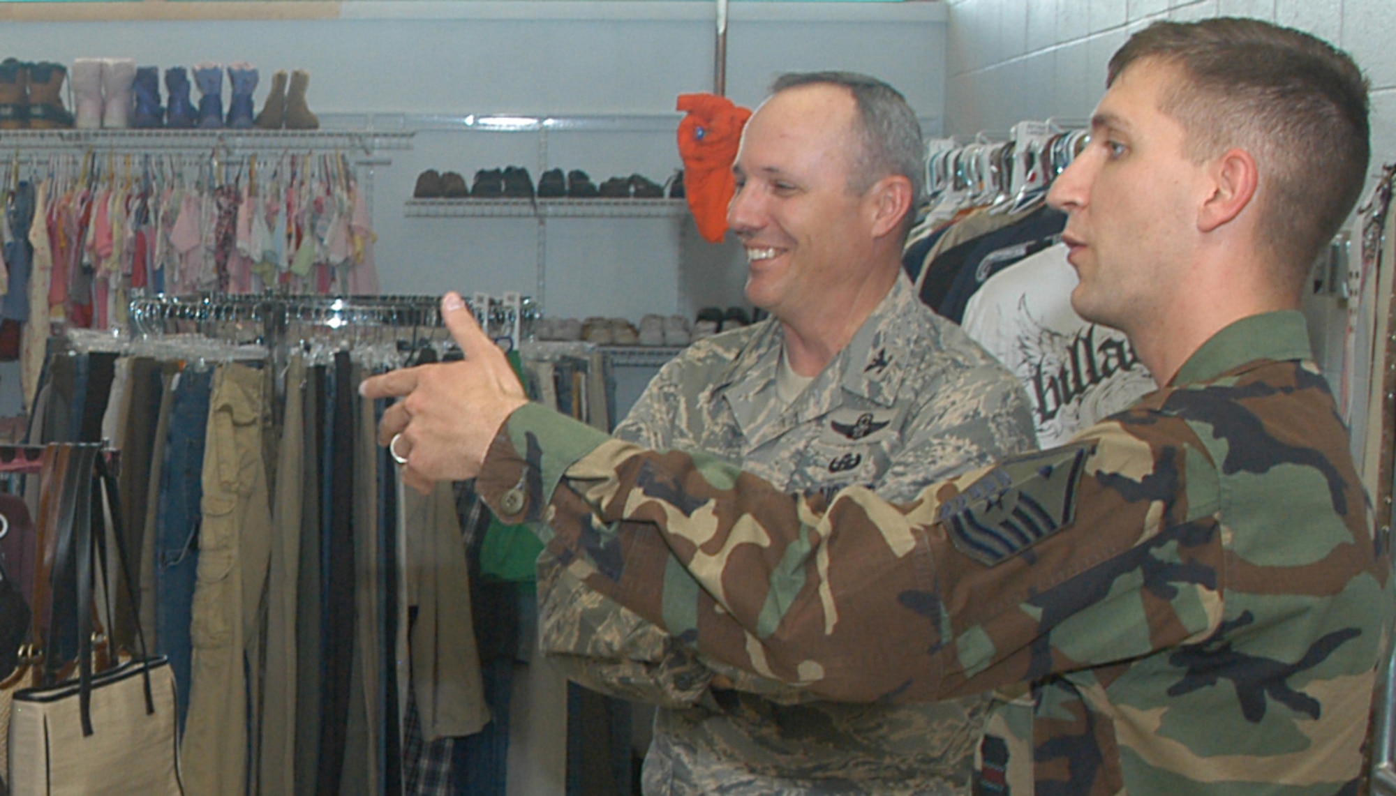 Master Sgt. Dominic Dumbra, 55th Force Support Squadron first sergeant, introduces the new Airman's Attic to Col. Robert Maness, 55th Wing vice commander, during the grand opening here July 2. (Courtesy Photo)