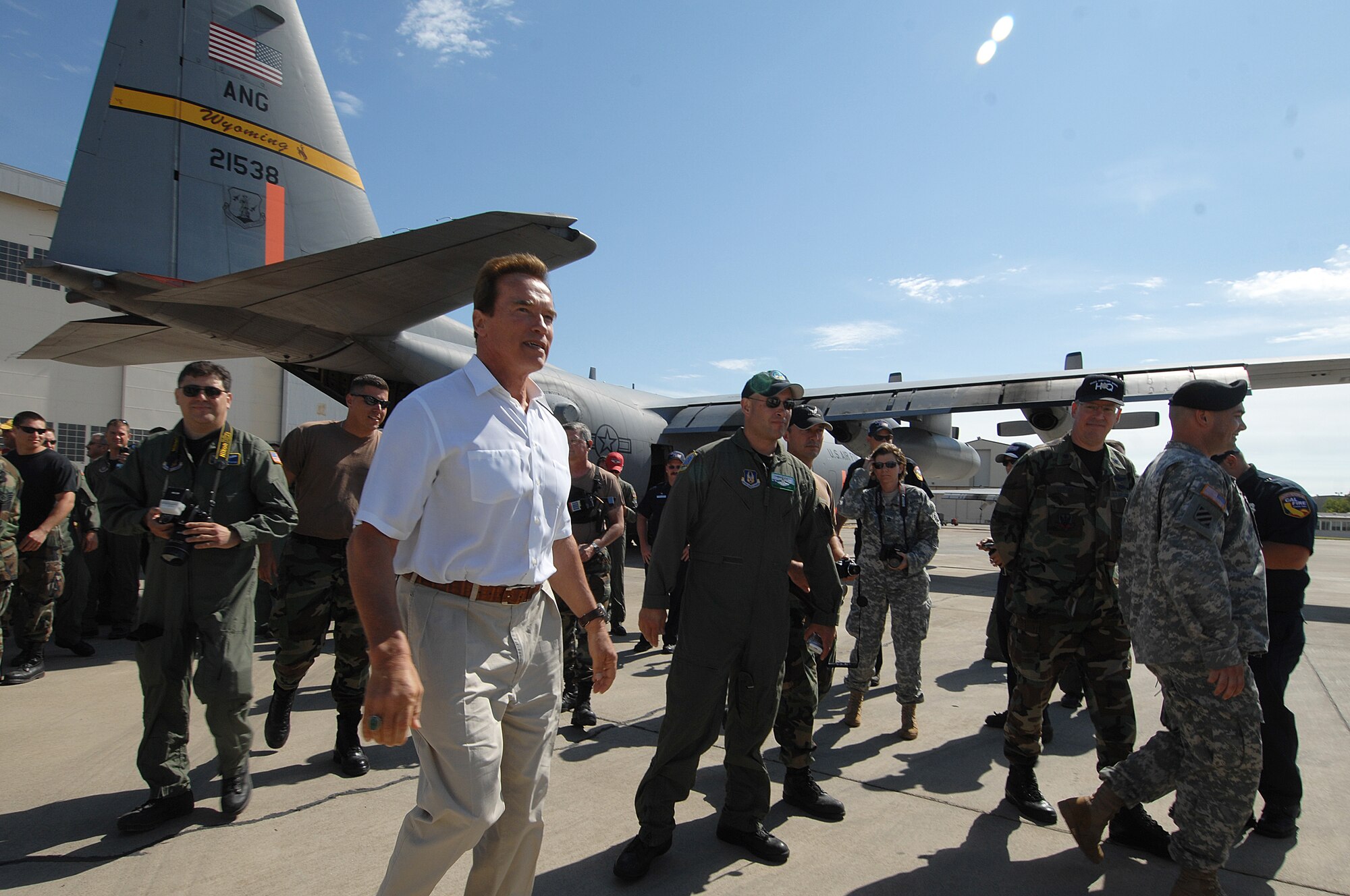 California Governor Arnold Schwarzenegger visits with members of the 302nd Air Expeditionary Group at McClellan Airfield, Calif., July 4 to thank them for their service in assisting with the California wildfires.  (U.S. Air Force photo/Staff Sgt. Hector Garcia)
