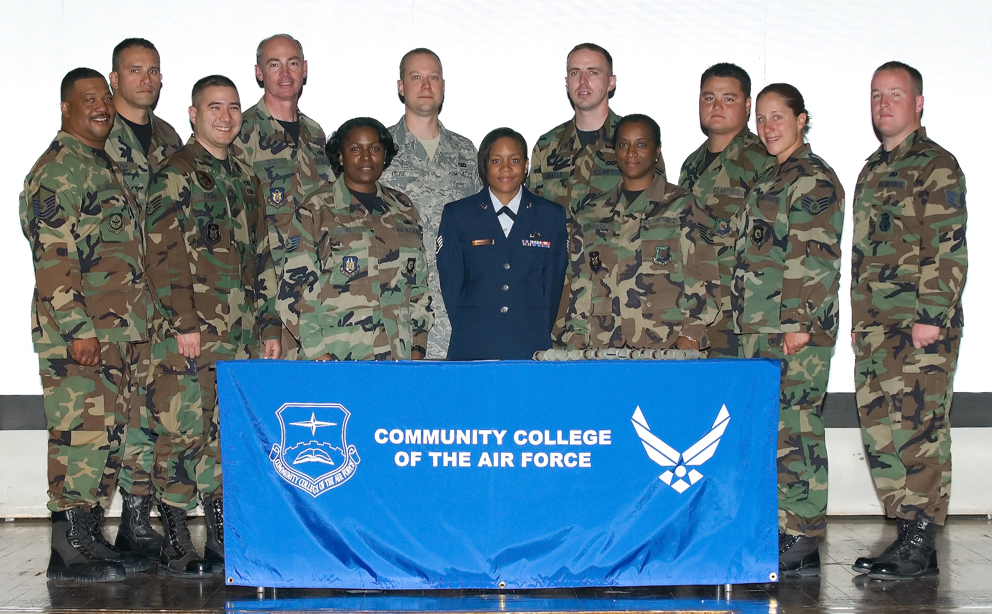 A dozen 512th Airlift Wing members received their associate's degree during a Community College of the Air Force graduation ceremony at the base theater June 22. (U.S. Air Force photo/Jason Minto)
