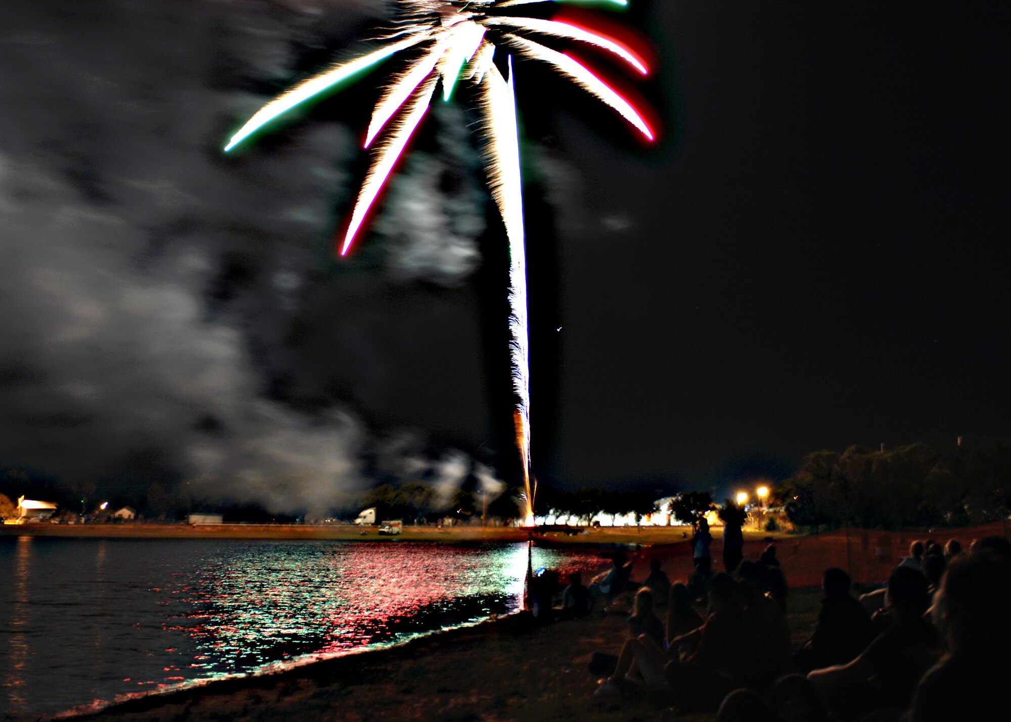 CANNON AIR FORCE BASE, N.M. -- A crowd watches as fireworks light up the sky at Green Acres Park in nearby Clovis, N.M. July 4.The annual Smoke on the Water show near the lake drew city residents and Airmen who enjoyed the festivities. (Air Force photo by Greg Allen) 