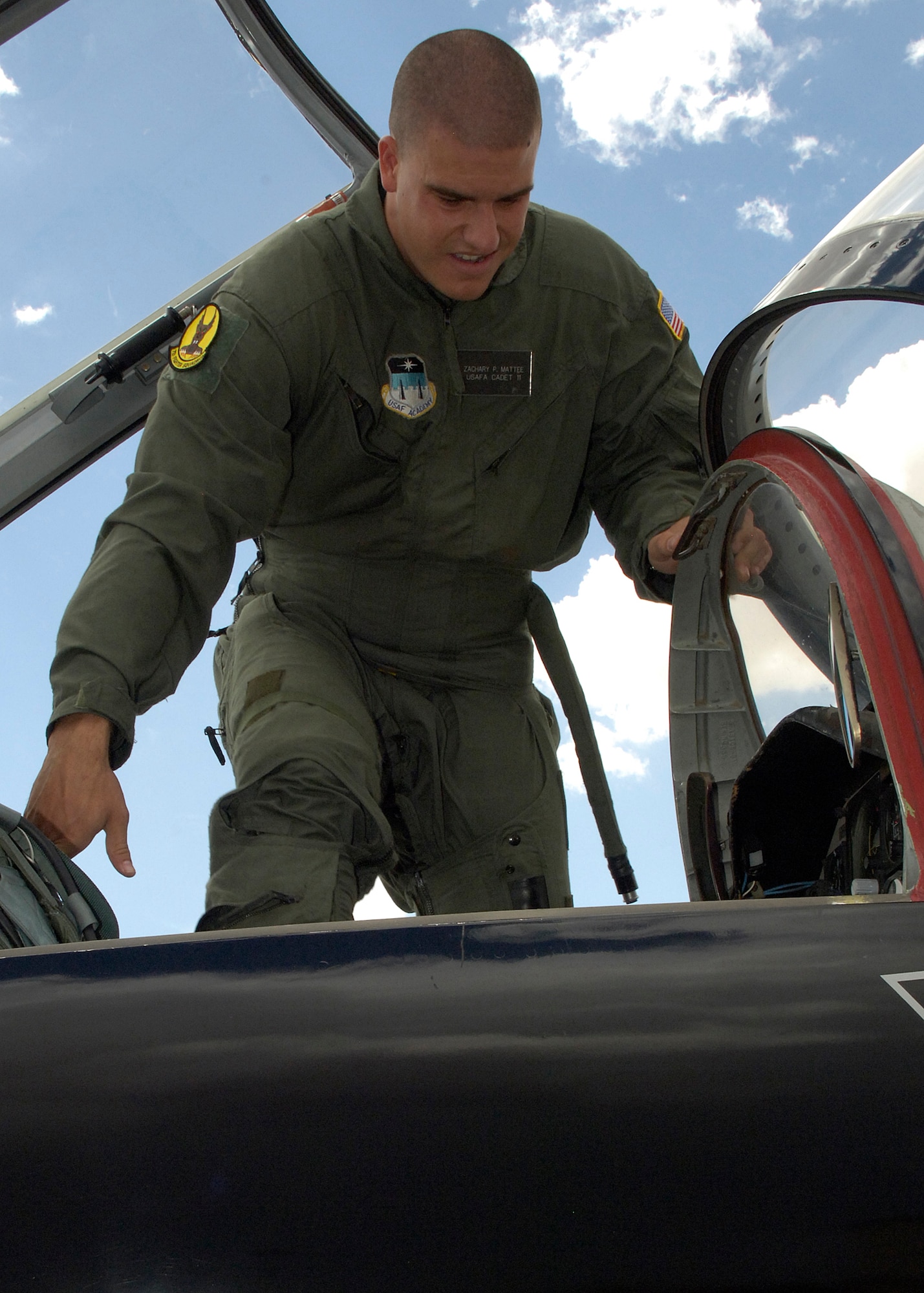 Air Force Academy Cadet Zach Mattee climbs into a T-38 before his incentive flight at Holloman Air Force Base, N.M., July 2. Cadets visited Holloman as part of the Operations Air Force program. The program is known for providing every cadet with an incentive ride during their visit. (U.S. Air Force photo/Airman 1st Class Michael Means)