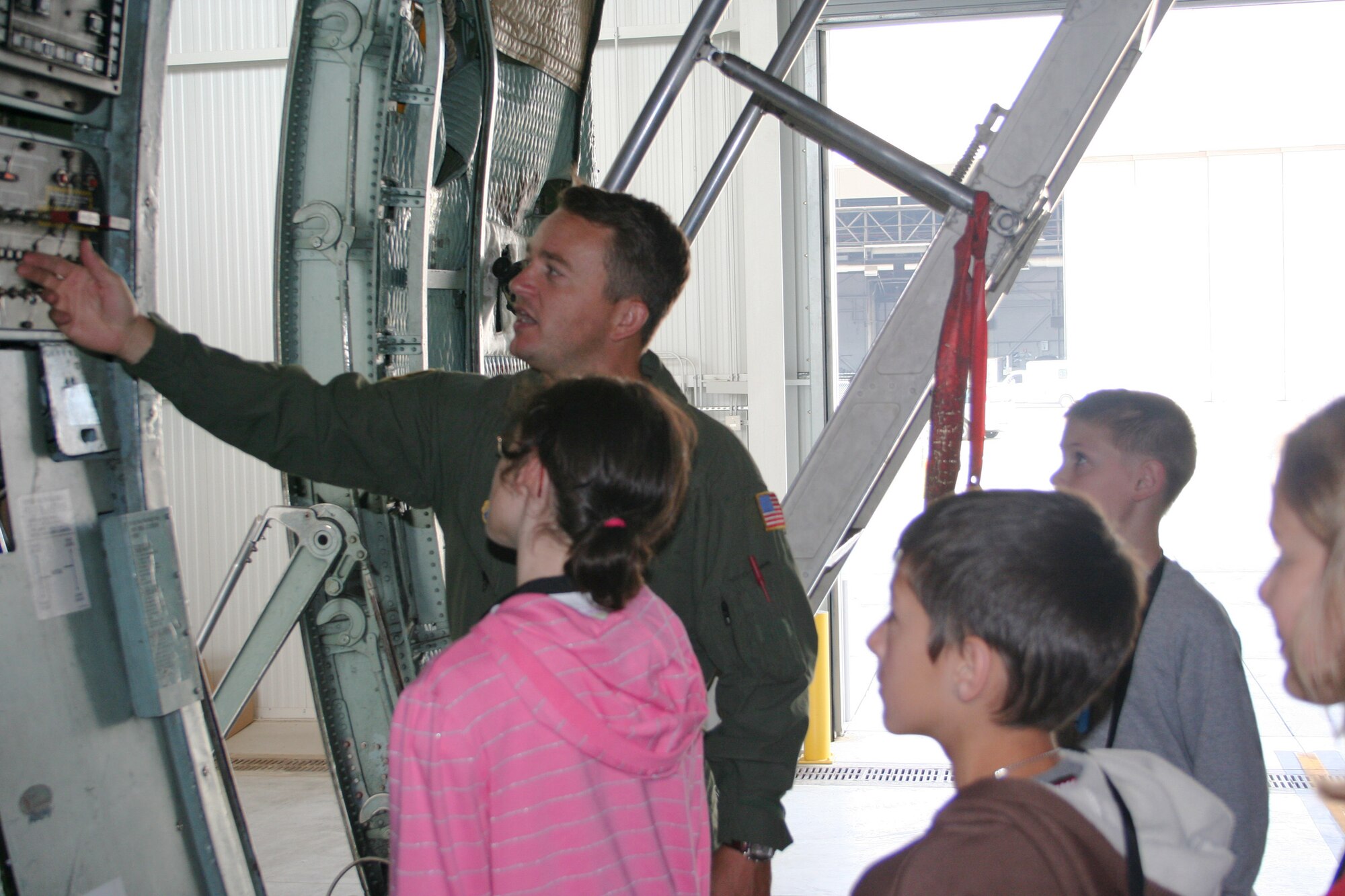 WRIGHT-PATTERSON AFB, Ohio - Master Sgt. Larry Unger, 89th Airlift Squadron, talks to a group of children from Operation Purple Summer Camp during a tour of a  445th Airlift Wing C-5 Galaxy.  

In 2004, the Operation Purple® Summer Camp Program was created as a way to help military children struggling with having a parent deployed.  Due to the success of the camp program, it expanded and has hosted more than 10,000 military children who have or will experience deployment.  In 2008, there will be 100 weeks of camp held in 62 locations in 37 states and territories. 

These free, week-long, overnight camps are open to all military children. The program aims to help military kids experience carefree fun while also learning coping skills to deal with war-related stress and fostering relationships with others who know what they are going through. (U.S. Air Force photo/Laura Darden)


