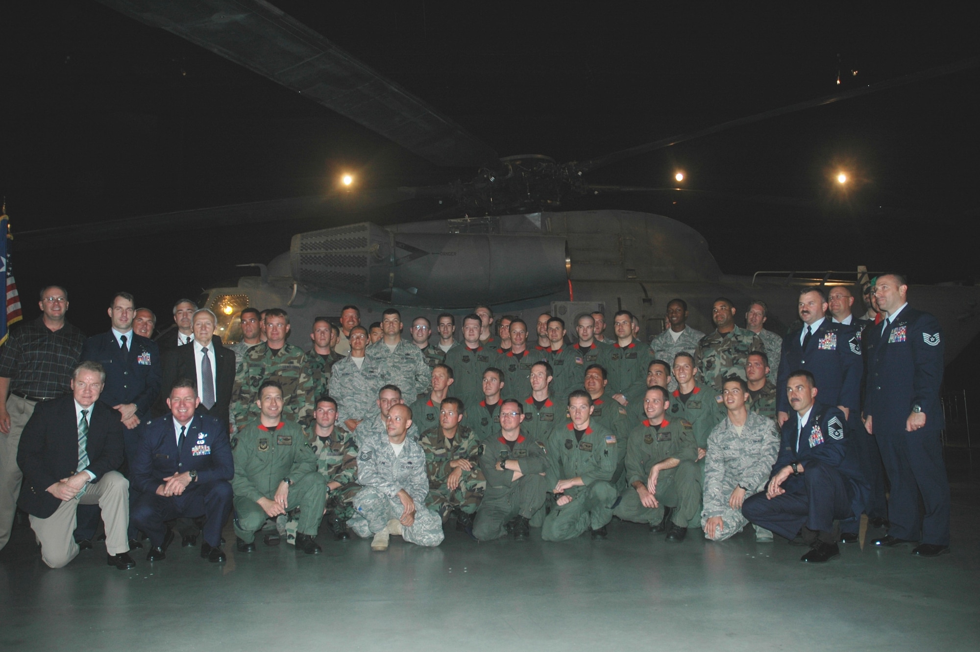 Current and former members of the 20th Special Operations Squadron and the 1st Special Operations Helicopter Maintenance Squadron and former Son Tay Raid participants gather by an MH-53 PAVE LOW before a ceremony inducting the aircraft into the National Museum of the United States Air Force in Dayton, Ohio June 7. The PAVE LOW flew for 38 years and is the only Son Tay Raid helicopter not lost in combat. The remaining MH-53s will be retired by Sept. 30. (U.S. Air Force Photo/2nd Lt. Lauren Johnson)