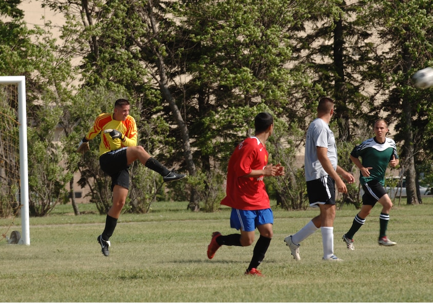 MINOT AIR FORCE BASE, N.D. -- Senior Airman Jonathan Toro-Caloyeropoulos, goal keeper for the 791st Missile Security Forces Squadron, kciks the ball downfield following a goal attempt by the 5th Civil Engineer Squadron during a soccer match here July 8. The 791st MSFS defeated the 5th CES by a score of 2-0. Soccer is one of the many intramural sports enjoyed by Airmen at Minot AFB. (U.S. Air Force photo by Airman 1st Class Sharida Bishop)