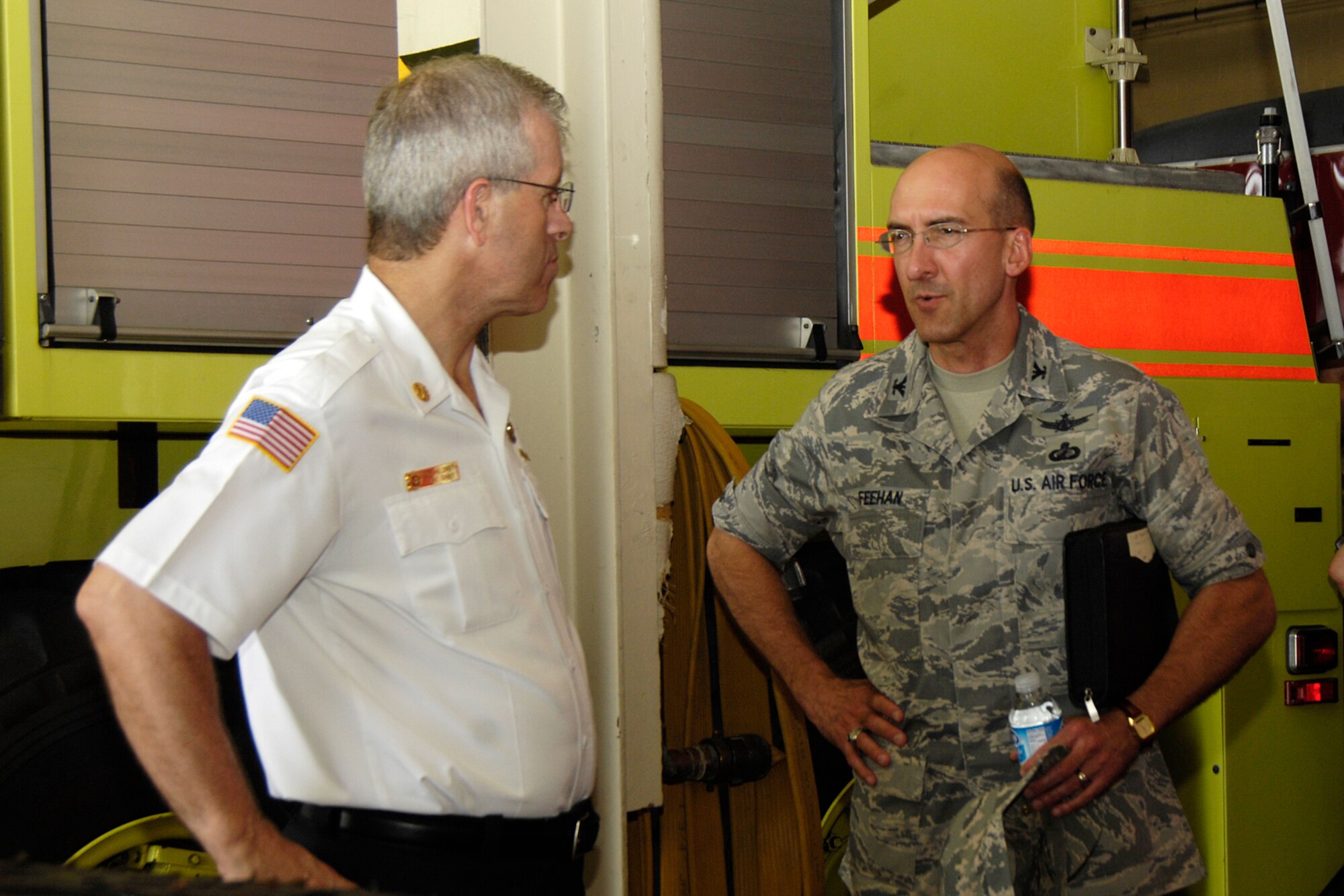 HANSCOM AFB, Mass. – Col. Terry Feehan (right), Electronic Systems Center vice commander speaks with Bob Hildreth (left), Hanscom Fire Department chief, on July 8 at the Fire Department during an orientation visit to the 66th Air Base Wing. (U.S. Air Force photo by Linda LaBonte Britt)