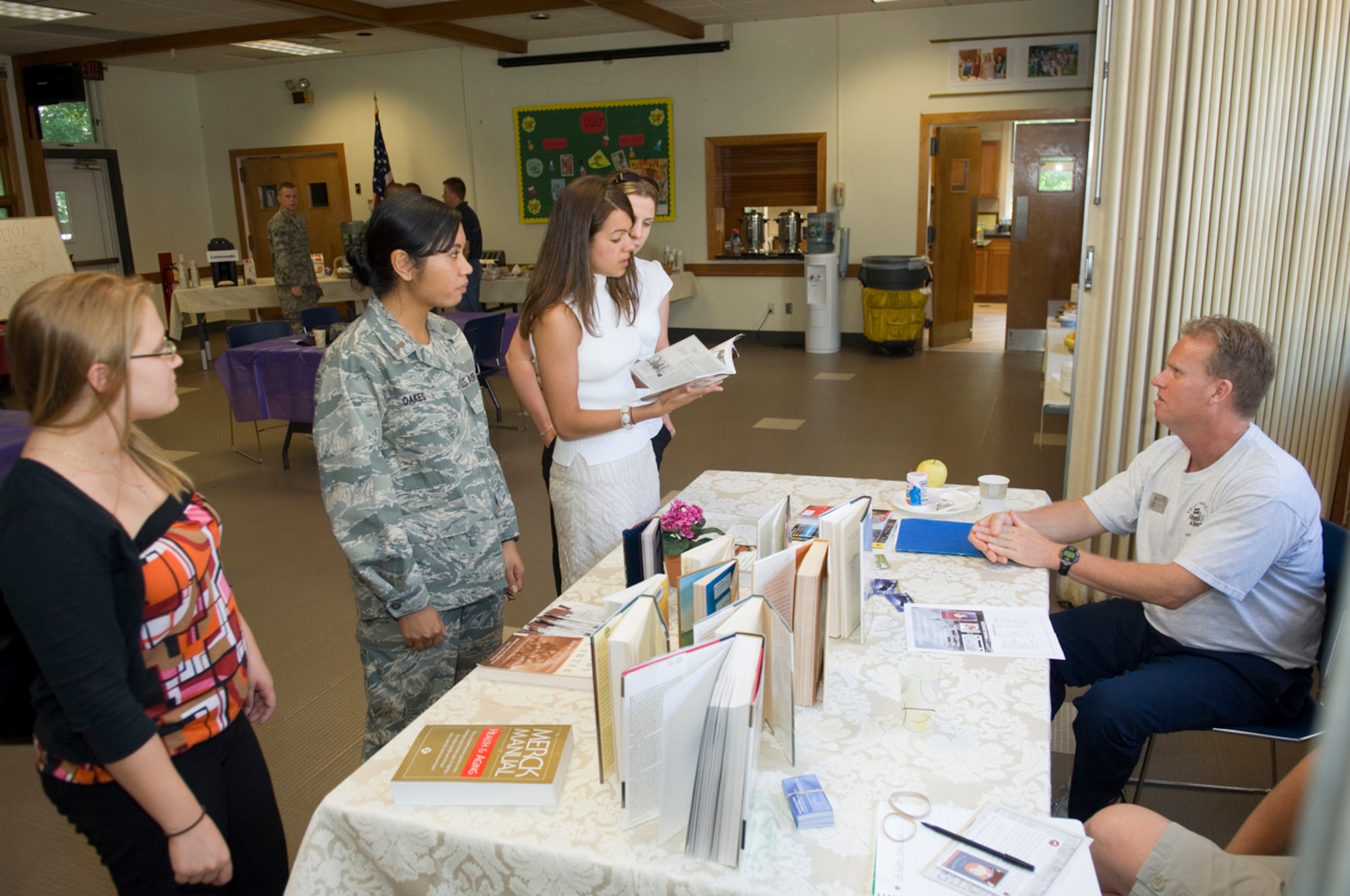 HANSCOM AFB, Mass. – Bill Anderson (right), 66th Services Squadron, Fitness and Sports Center, speaks with attendees to the Spiritual Wellness Open House at the Base Chapel on July 8. The event was held to celebrate July as Air Force Materiel Command’s Spiritual Wellness month. Attendees had an opportunity to enjoy a free breakfast, Spiritual Pictionary, a relaxation class and discussion groups about spiritual wellness. (U.S. Air Force photo by Rick Berry)

