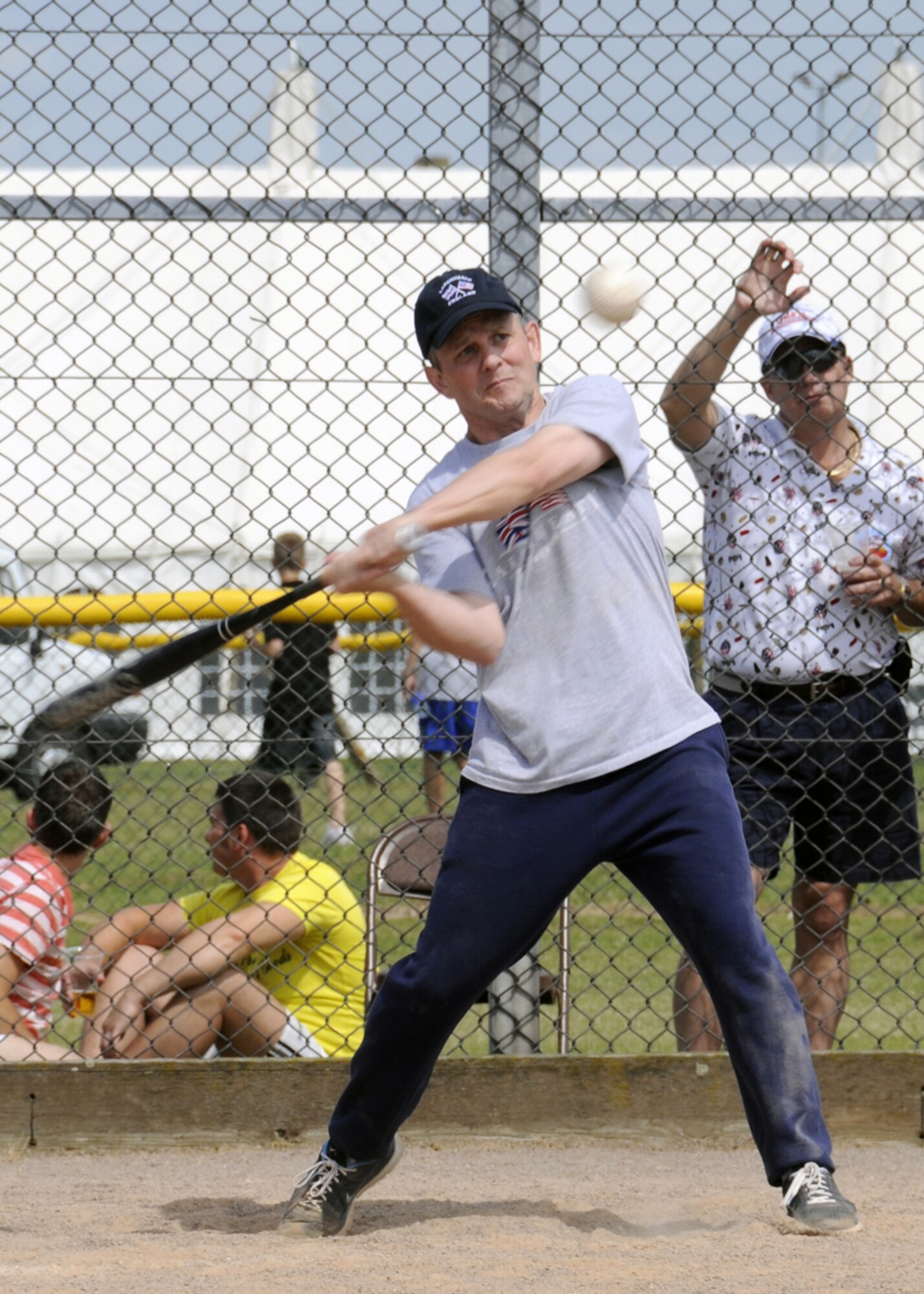 Brigadier General John Hesterman, 48th Fighter Wing Commander swings at the ball during the Chiefs Vs. Eagles softball game July 4 at RAF Feltwell. The chiefs beat the eagles 28 to 11 for the first time since 2003. (U.S. Air Force photo by Airman Perry Aston)