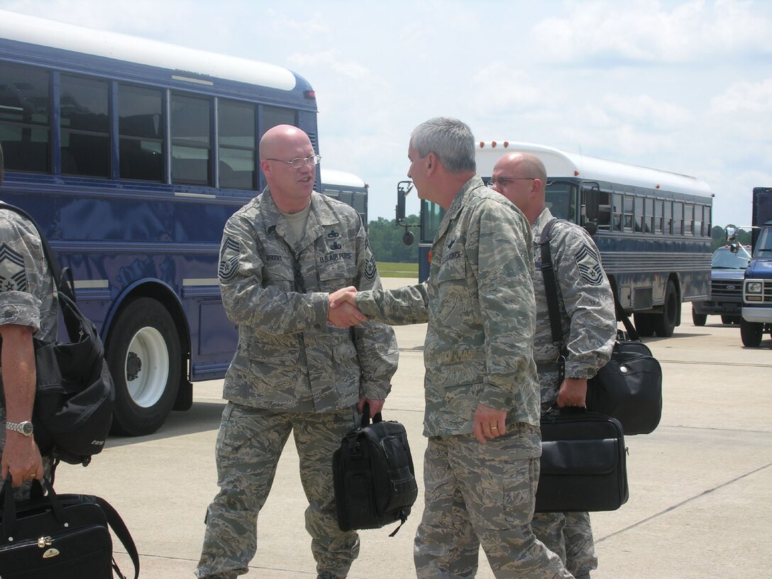 SEYMOUR JOHNSON AIR FORCE BASE, N.C. -- Col. Fritz Linsenmeyer, wing commander (right) welcomes Chief Master Sgt. David Brooks to the 916th Air Refueling Wing. Chief Brooks is part of a 90-member inspection team visiting the Reserve wing July 9-16. All areas from medical to maintenance to flying to office functions will be inspected on their abilities to perform their jobs for compliance. While other inspections view the reservists ability to survive and operate in a wartime setting, this inspection is mainly viewing paperwork and procedures to ensure the wing is accurately running its day-to-day business. U.S. Air Force photo/Ms. Donna Lea