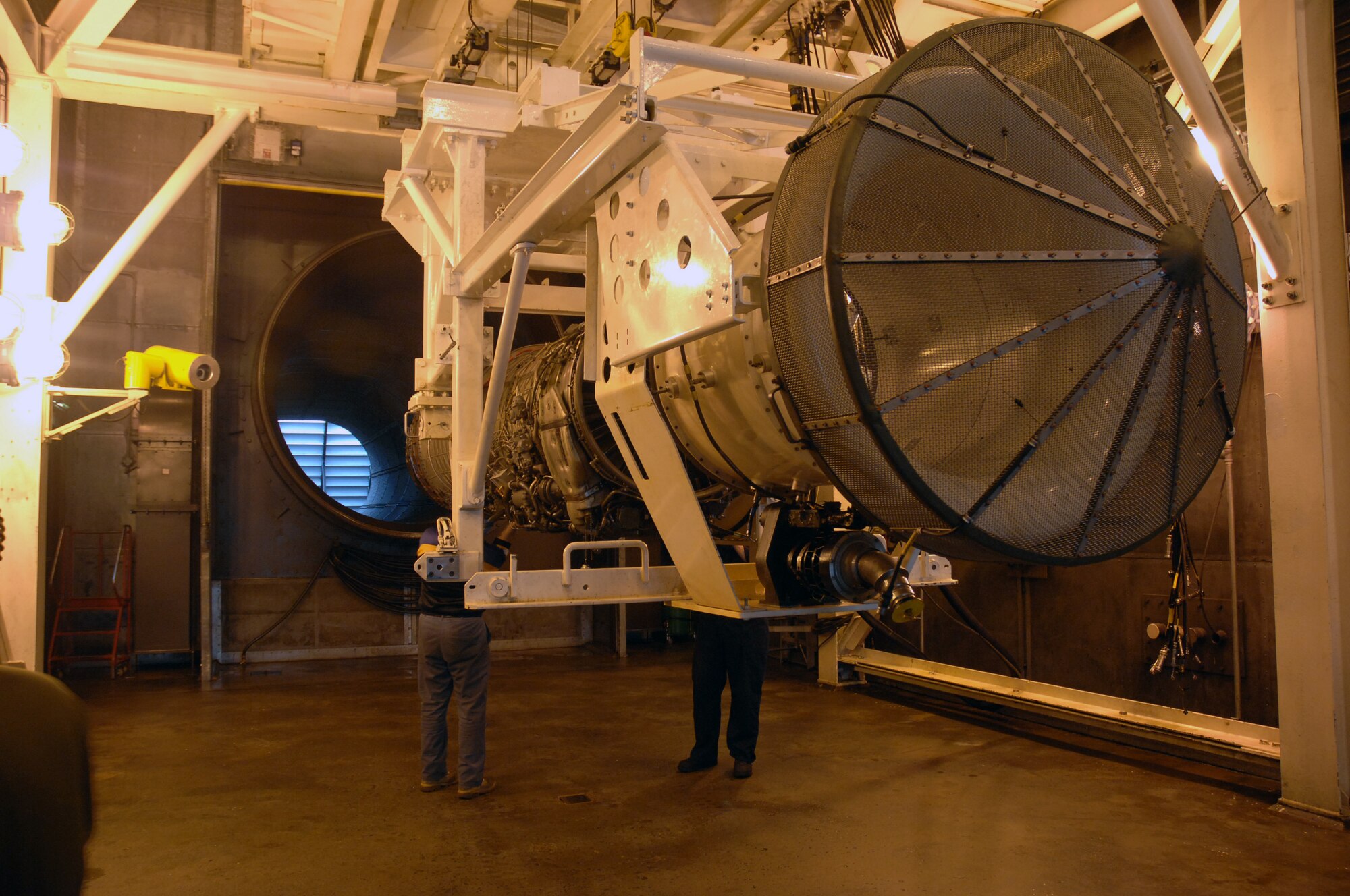 48th Component Maintenance Squadron members raise a jet engine into position to complete the testing process.  The unit checks the engine in more than 15 different areas to ensure Liberty Wing pilots have the best engines available. (U.S. Air Force Photo by Master Sgt. Edward Bard)