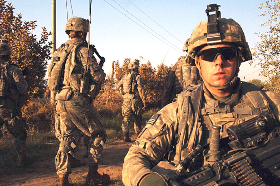 U.S. Army Staff Sgt. Jeremy Johnson provides security during an air assault mission conducted around the city of Mahmudiyah, Iraq, July 3, 2008. The soldiers are assigned to the 101st Airborne Division's 3rd Brigade,187 Infantry Regiment.