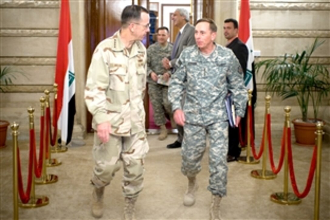 U.S. Navy Adm. Mike Mullen, chairman of the Joint Chiefs of Staff, and U.S. Army Gen. David Petraeus, commanding general of Multinational Force-Iraq, depart a meeting with Iraqi Prime Minister Nouri al-Maliki, in Baghdad, Iraq, July 9, 2008. Mullen is on a six-day tour of the region to visit troops and host a USO tour.