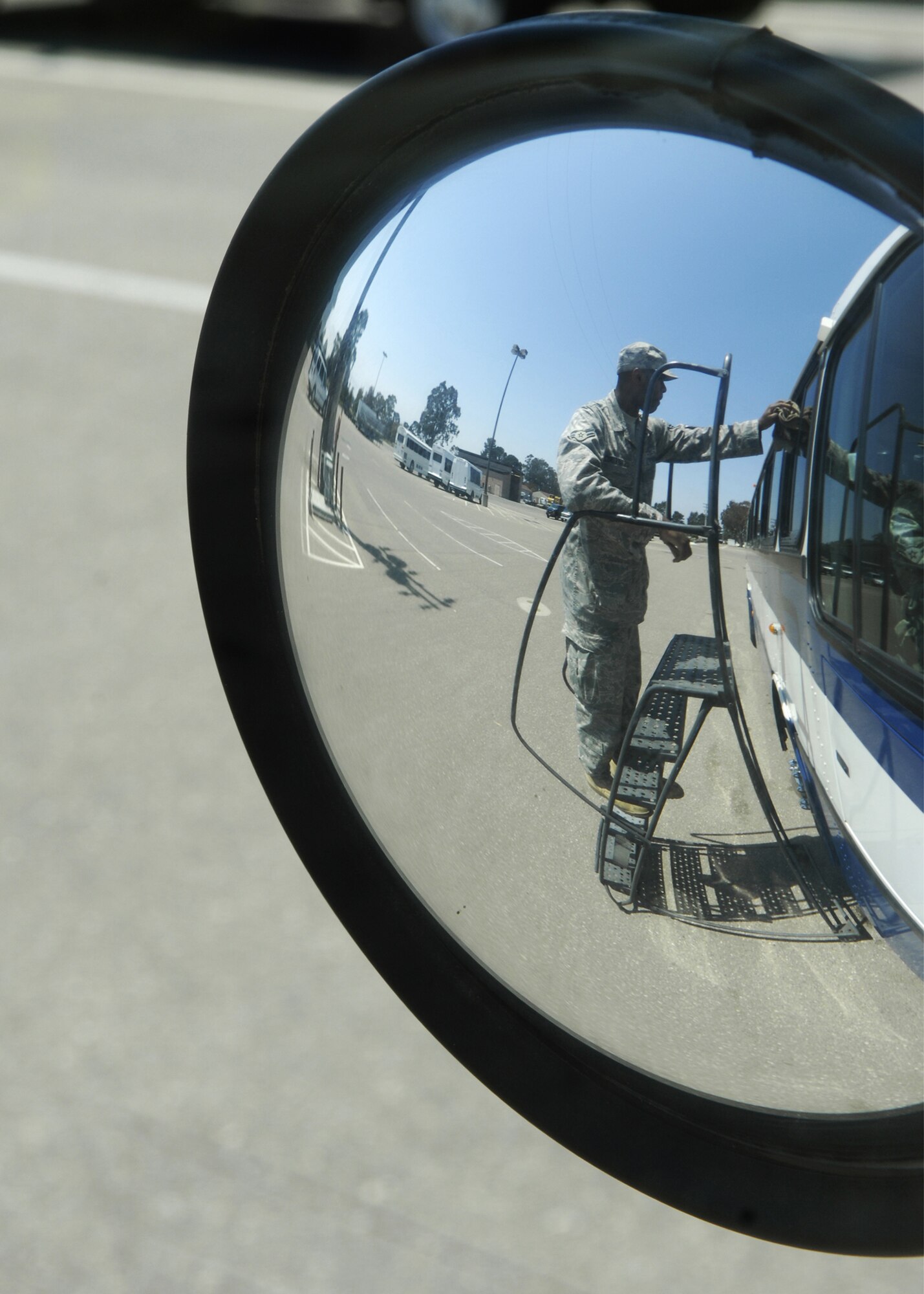 Airman 1st Class Eddie Chaney, a vehchle operator with the 30th Logistics Readiness Squadron, cleans and inspects a bus as part of his daily duties. Airmen of the 30th LRS are responsible for the maintnance and care of all base transportation equipment.(Air Force Photo/Airman 1st Class Heather Shaw) 