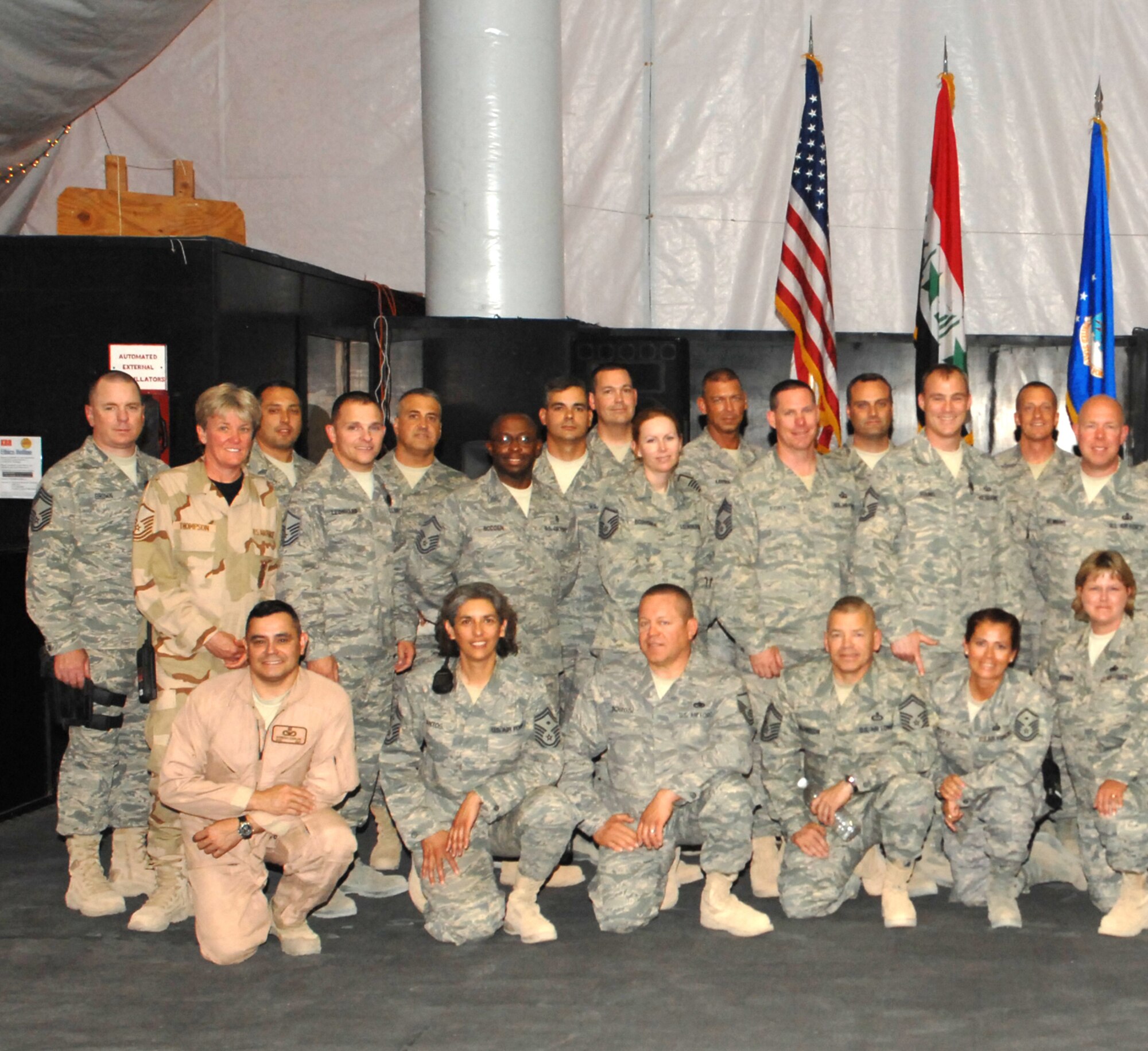 932nd Airlift Wing Command Chief Master Sgt. Sandra Santos is seen here (first row, second from left) deployed to Iraq working with fellow Air Force enlisted airmen in the Top Three organization, which is designed to assist their fellow Air Force members.  Photo submitted.