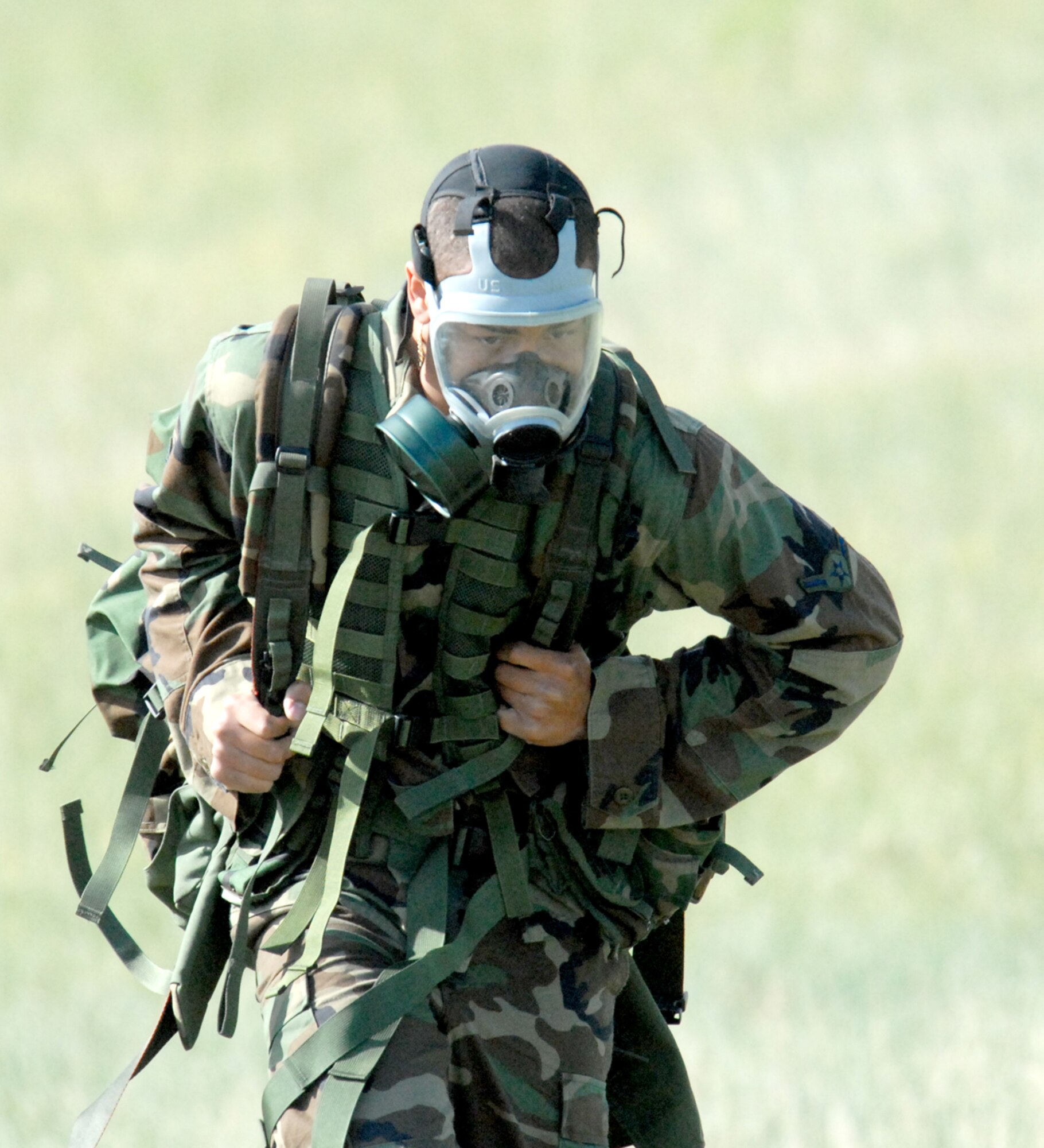 An Airman readies his rucksack during one portion of the Crow Creek Challenge June 26. The Airmen donned the sacks, all different weights, and raced to and from the finish line. The team with the fastest time won the event.