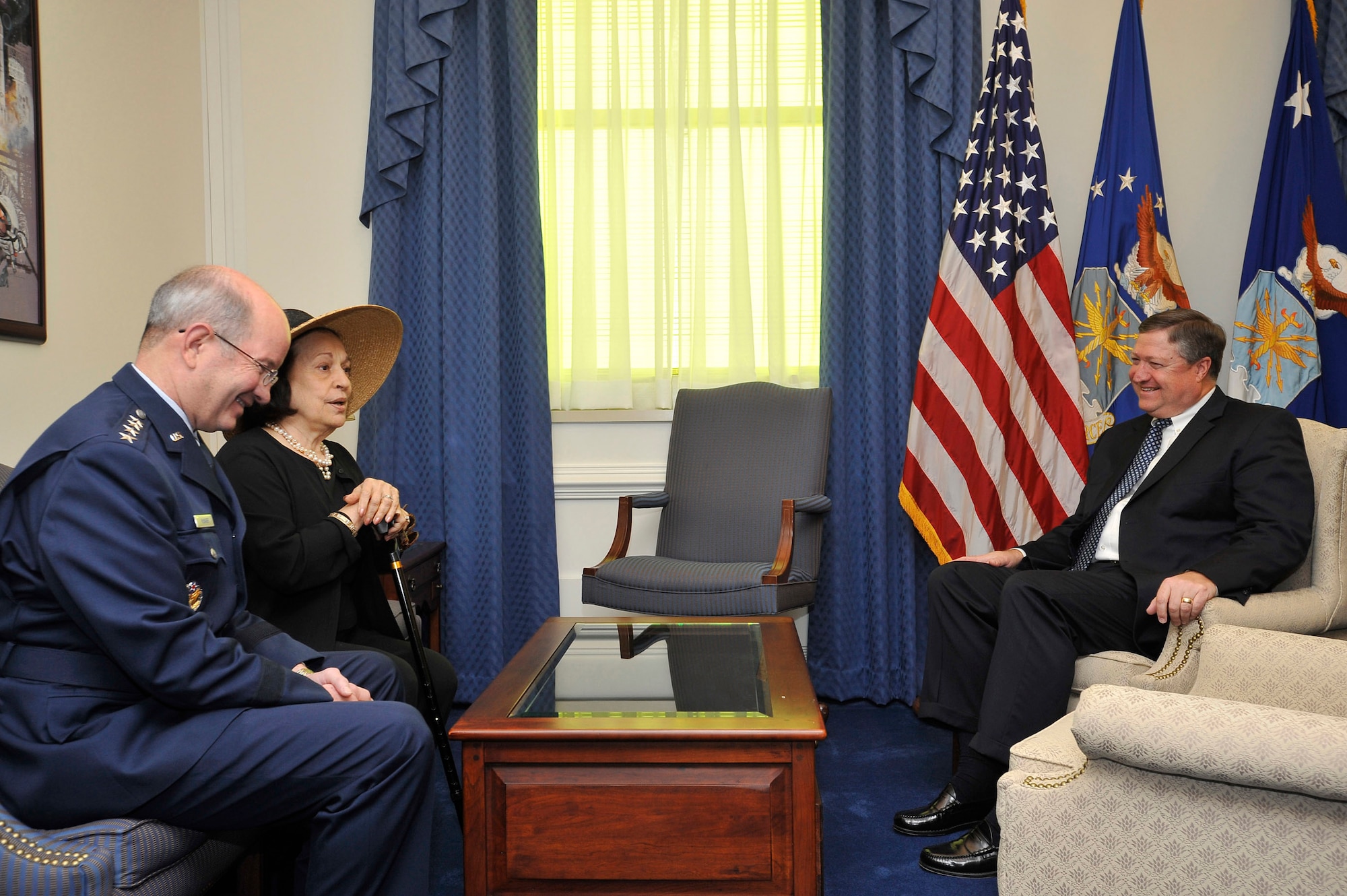 Joni James, widow of Gen. Bernard Schriever, speaks with Air Force Vice Chief of Staff Gen. Duncan J. McNabb and acting Air Force Secretary Michael B. Donley during an office call prior to the unveiling of a portrait of her late husband July 8 at the Pentagon. The portrait, a pencil drawing by Air Force visual information specialist Thomas Segars, will hang permanently as a memorial to General Schriever. (U.S. Air Force photo/Scott M. Ash) 