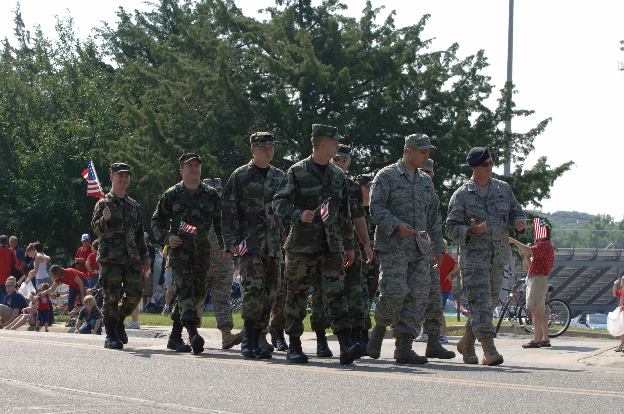 MCCONNELL AIR FORCE BASE, Kan. -- Team McConnell members participate in the Fourth of July Parade held in Derby, Kan., July 4. Team McConnell members participated in the local parade showing their patriotism and their dedication to the community. (Photo by Staff Sgt. Jamie Train)