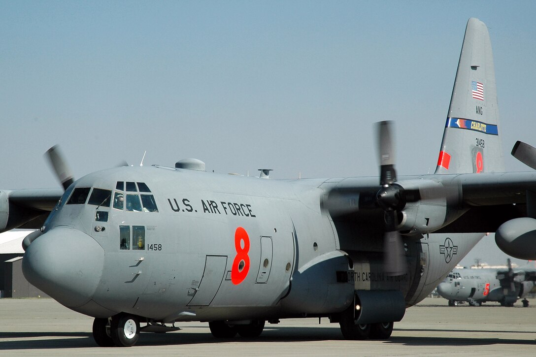 A C-130 Hercules assigned to the North Carolina Air National Guard's 145th Airlift Wing taxies down the ramp at McClellan Airfield in Sacramento, Calif., after completing a successful mission of dropping fire retardant on the Piute fire burning in California's Sequoia National Forest.  Aircrews and maintainers from the 145th AW are in California to assist with firefighting operations as part of the 302nd Air Expeditionary Group.  (U.S. Air Force photo/Staff Sgt. Luke Johnson)