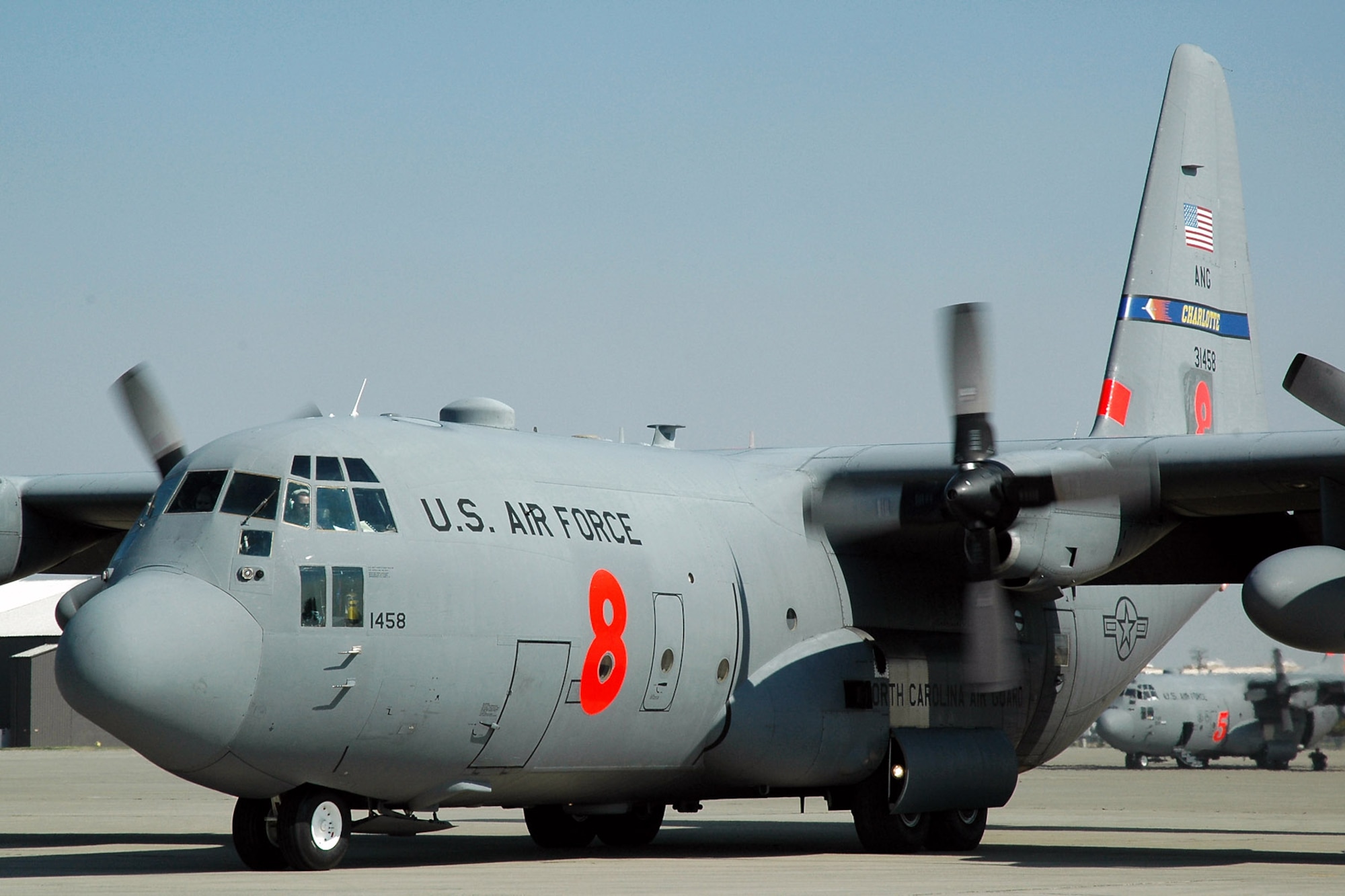 A C-130 Hercules assigned to the North Carolina Air National Guard's 145th Airlift Wing taxies down the ramp at McClellan Airfield in Sacramento, Calif., after completing a successful mission of dropping fire retardant on the Piute fire burning in California's Sequoia National Forest.  Aircrews and maintainers from the 145th AW are in California to assist with firefighting operations as part of the 302nd Air Expeditionary Group.  (U.S. Air Force photo/Staff Sgt. Luke Johnson)