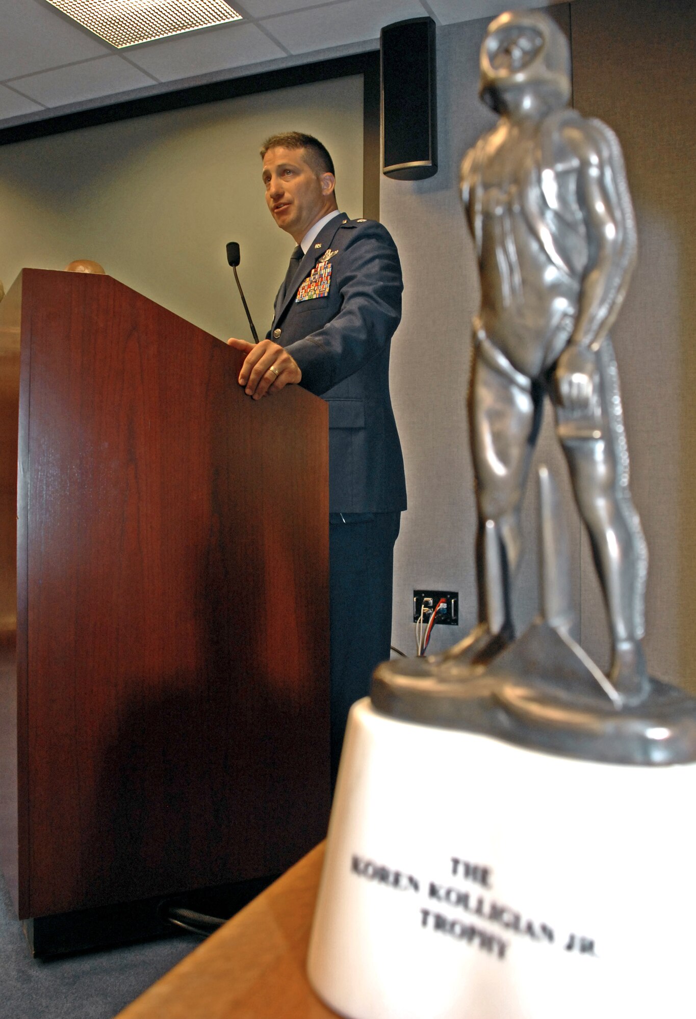 Lt. Col. Eugene Becker, 20th Special Operations Squadron, addresses the crowd during a recent ceremony at the Pentagon, where he was presented the Koren Kolligian Jr. trophy . Colonel Becker was flying an MH-53M Pave Low helicopter on a training mission when it suffered a "catastrophic mechanical failure." Colonel Becker and his crew were able to safely land the helicopter, saving the lives of all seven crewmembers. (U.S. Air Force photo/Staff Sgt. J.G. Buzanowski) 