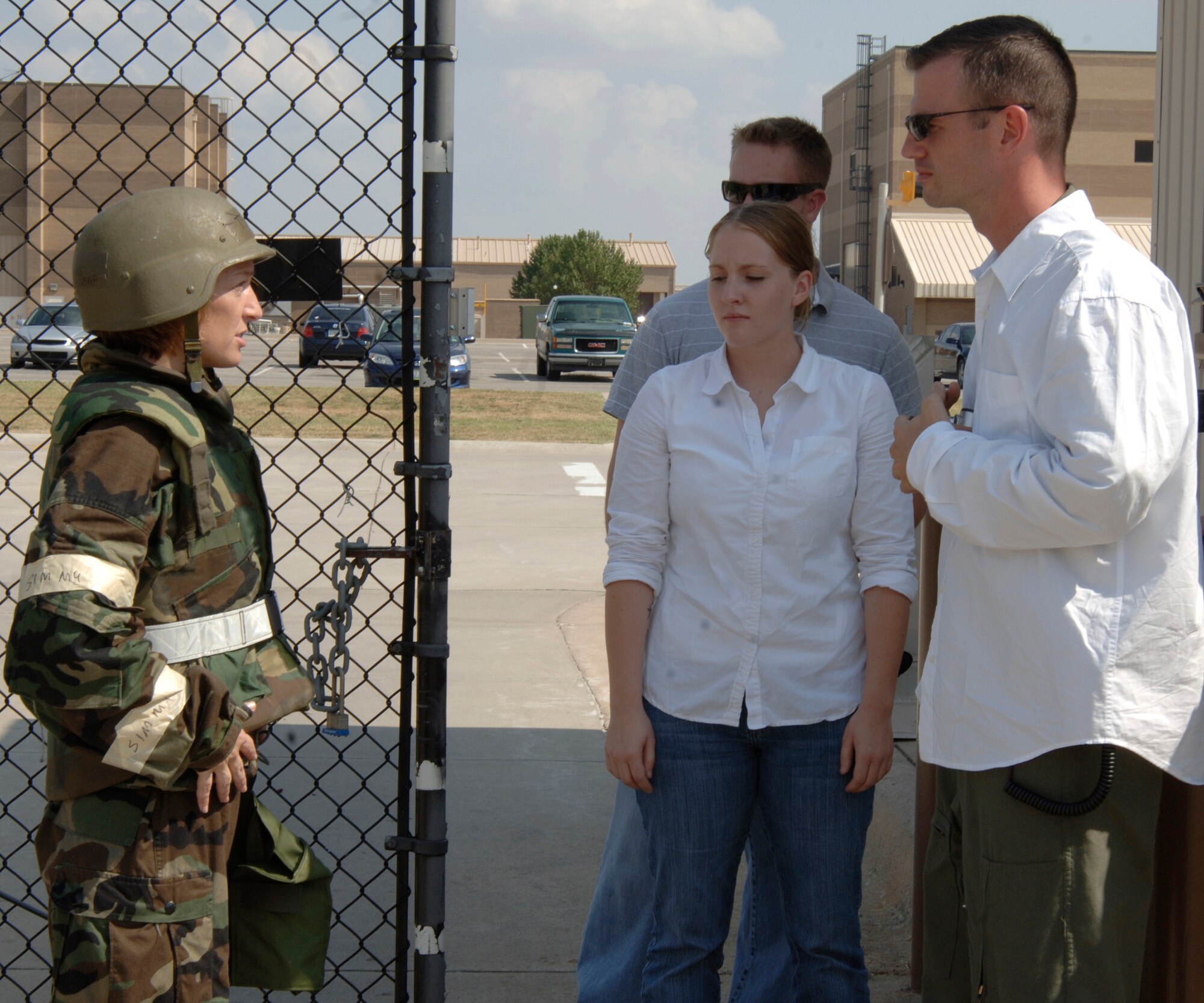 MCCONNELL AIR FORCE BASE, Kan. -- Major Michael Rambo, 22nd Air Refueling Wing Plans and Programs, questions Tech. Sgt. Genevieve Morris, 22nd Air Refueling Wing Public Affairs chief, on local news media operations during an ability to survive and operate exercise, Sept. 20. Major Rambo, in conjunction with exercise evaluation team members, tested the wing’s ability to survive and operate in hostile situations. (Photo by Airman Justin Shelton)