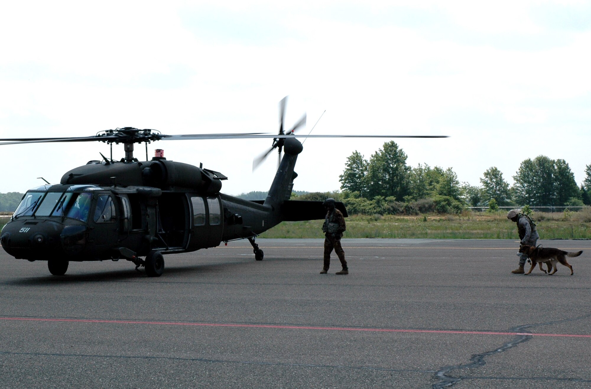 Students in the U.S. Air Force Expeditionary Center's Phoenix Warrior Training Course canine track learn about loading, unloading and flying aboard a Blackhawk helicopter July 8, 2008, on Fort Dix, N.J.  The instruction was part of training for the course where military working dog teams learn to fly aboard helicopters.  Phoenix Warrior is taught by the USAF EC's Expeditionary Operations School and 421st Combat Training Squadron preparing security forces for upcoming deployments.  (U.S. Air Force Photo/Staff Sgt. Paul R. Evans)