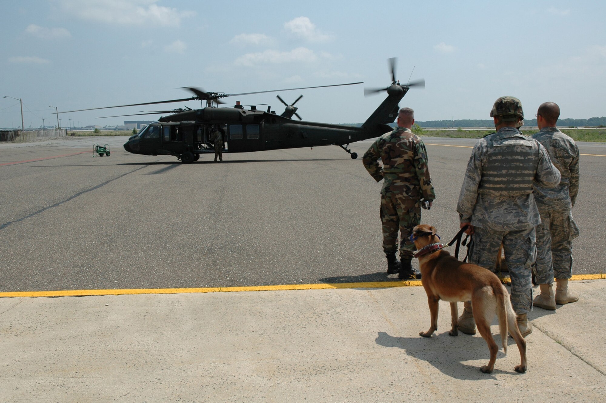 Students in the U.S. Air Force Expeditionary Center's Phoenix Warrior Training Course canine track learn about loading, unloading and flying aboard a Blackhawk helicopter July 8, 2008, on Fort Dix, N.J.  The instruction was part of training for the course where military working dog teams learn to fly aboard helicopters.  Phoenix Warrior is taught by the USAF EC's Expeditionary Operations School and 421st Combat Training Squadron preparing security forces for upcoming deployments.  (U.S. Air Force Photo/Staff Sgt. Paul R. Evans)