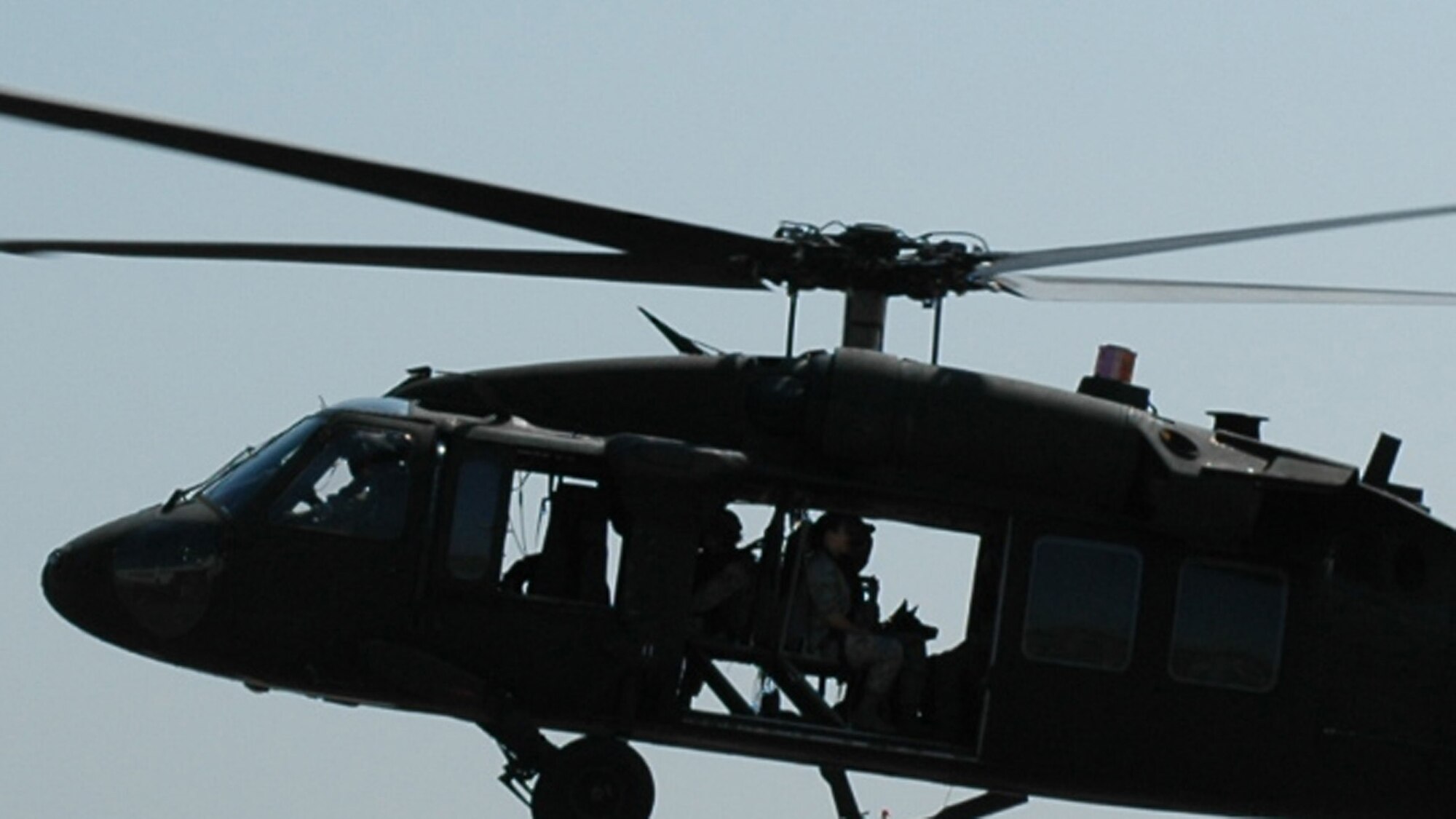 Students in the U.S. Air Force Expeditionary Center's Phoenix Warrior Training Course canine track learn about loading, unloading and flying aboard a Blackhawk helicopter July 8, 2008, on Fort Dix, N.J.  The instruction was part of training for the course where military working dog teams learn to fly aboard helicopters.  Phoenix Warrior is taught by the USAF EC's Expeditionary Operations School and 421st Combat Training Squadron preparing security forces for upcoming deployments.  (U.S. Air Force Photo/Staff Sgt. Paul R. Evans)