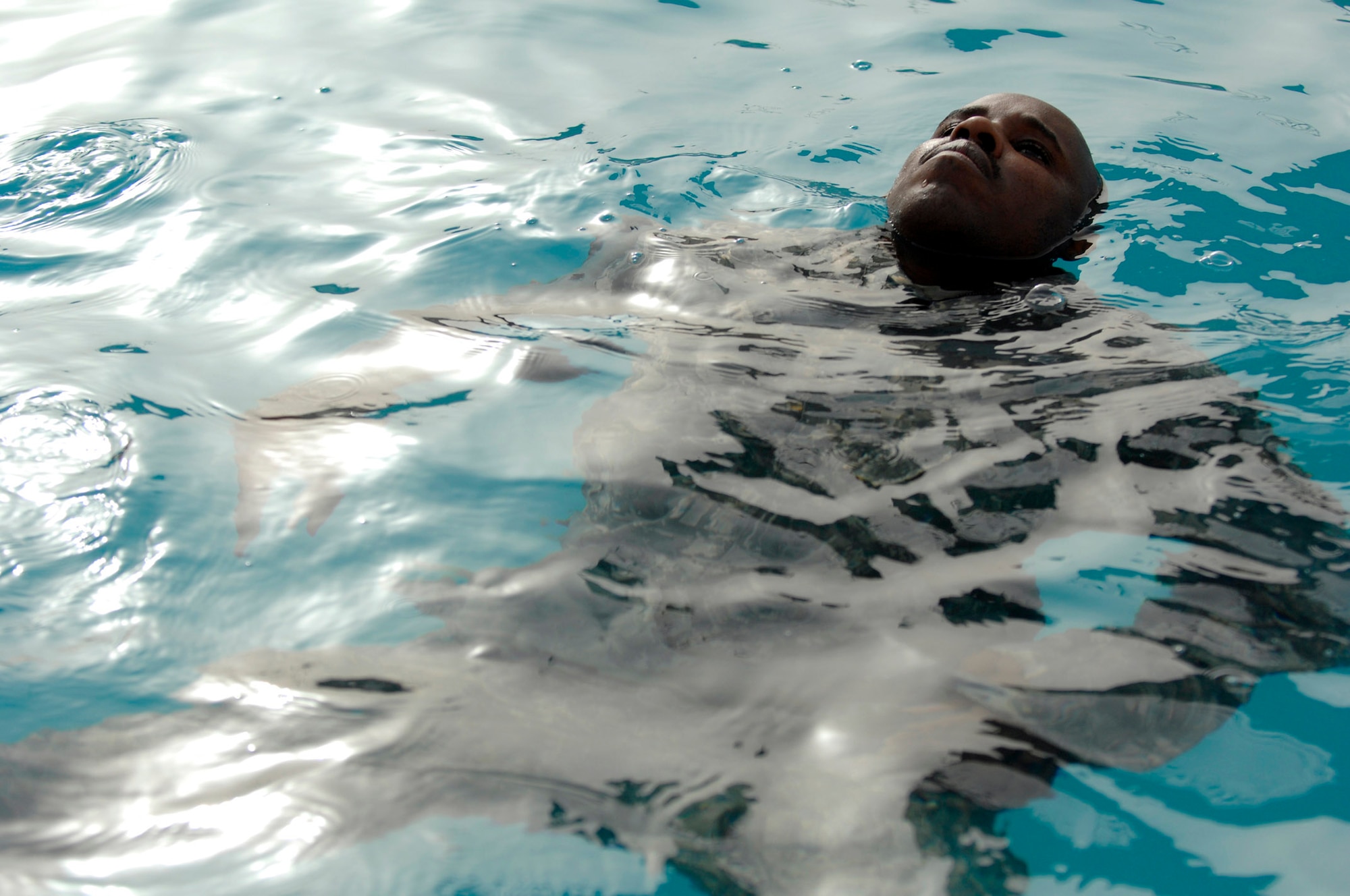 Tech. Sgt. Gerald Davis treads water during water skills training Joint Base Balad, Iraq, July 8. His ability to function in water is essential to the success of water operations. Sergeant Davis is a 332nd Expeditionary Civil Engineer Squadron explosive ordnance disposal technician. (U.S. Air Force photo/Senior Airman Julianne Showalter) 