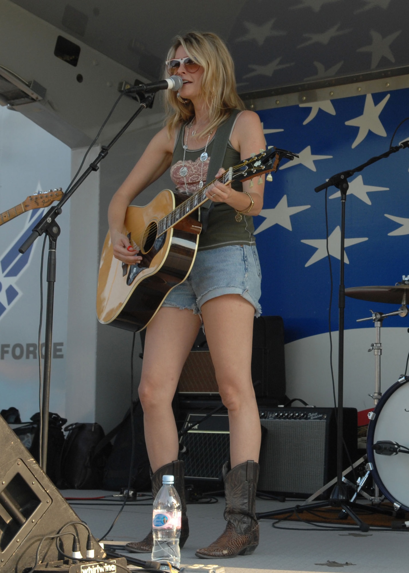 SEYMOUR JOHNSON AIR FORCE BASE, N.C. - Elizabeth Cook, singer for The Wrights, performs one of her songs for the crowd during the Military Appreciation Day celebration here July 3.  The event included live bands, games and rides for children, food and a fireworks display. (U.S. Air Force photo by Airman 1st Class Rae Henline)
