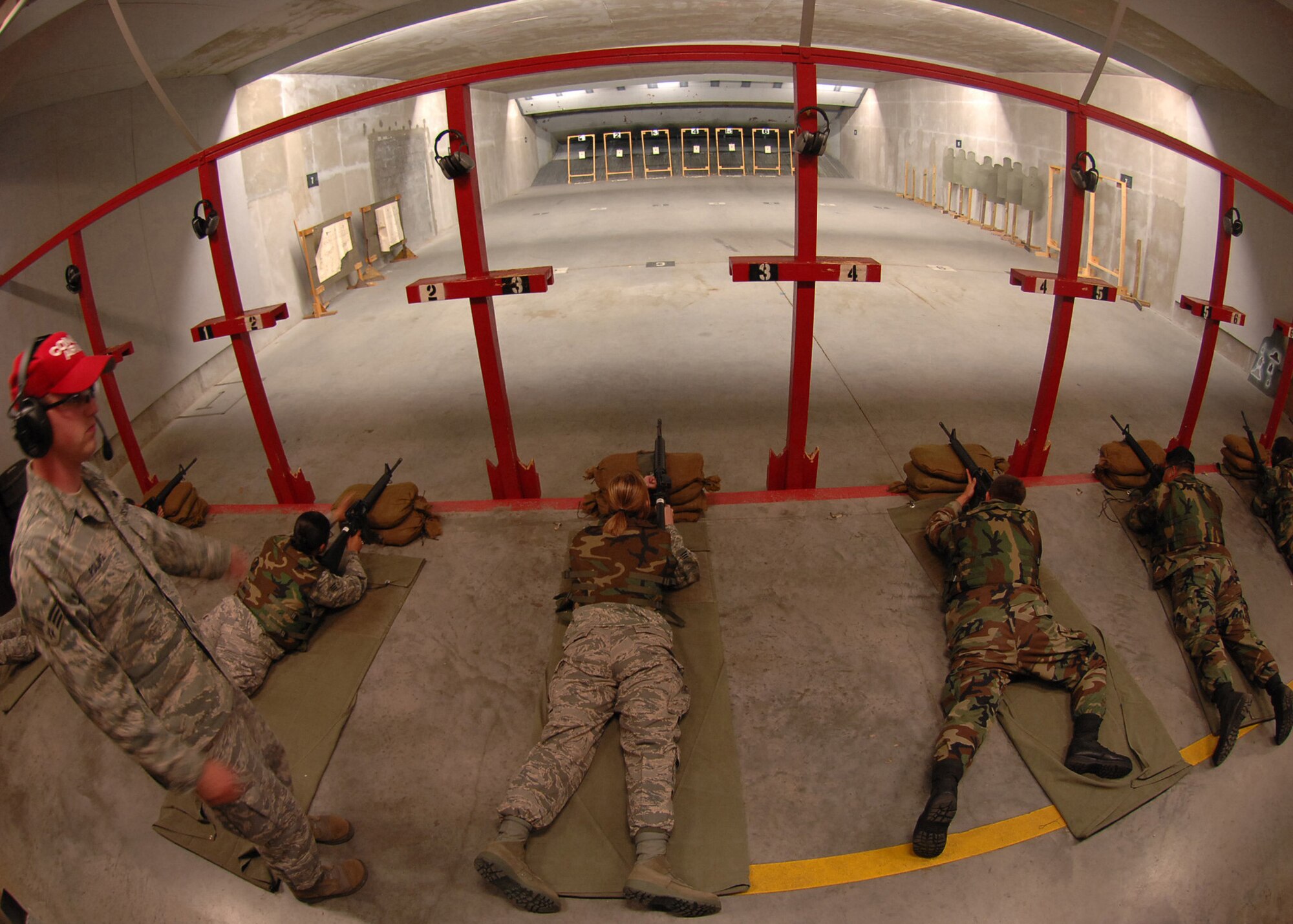 SEYMOUR JOHNSON AIR FORCE BASE, N.C. - Senior Airman Charles Poling, 4th Security Forces Squadron combat arms training and mainenance instructor, observes Airmen attending the M-16 qualifying course, July 2, 2008. Airmen must periodically qualify on the M-16 to remain deployable. (U.S. Air Force photo by Airman 1st Class Makenzie R. Lang)