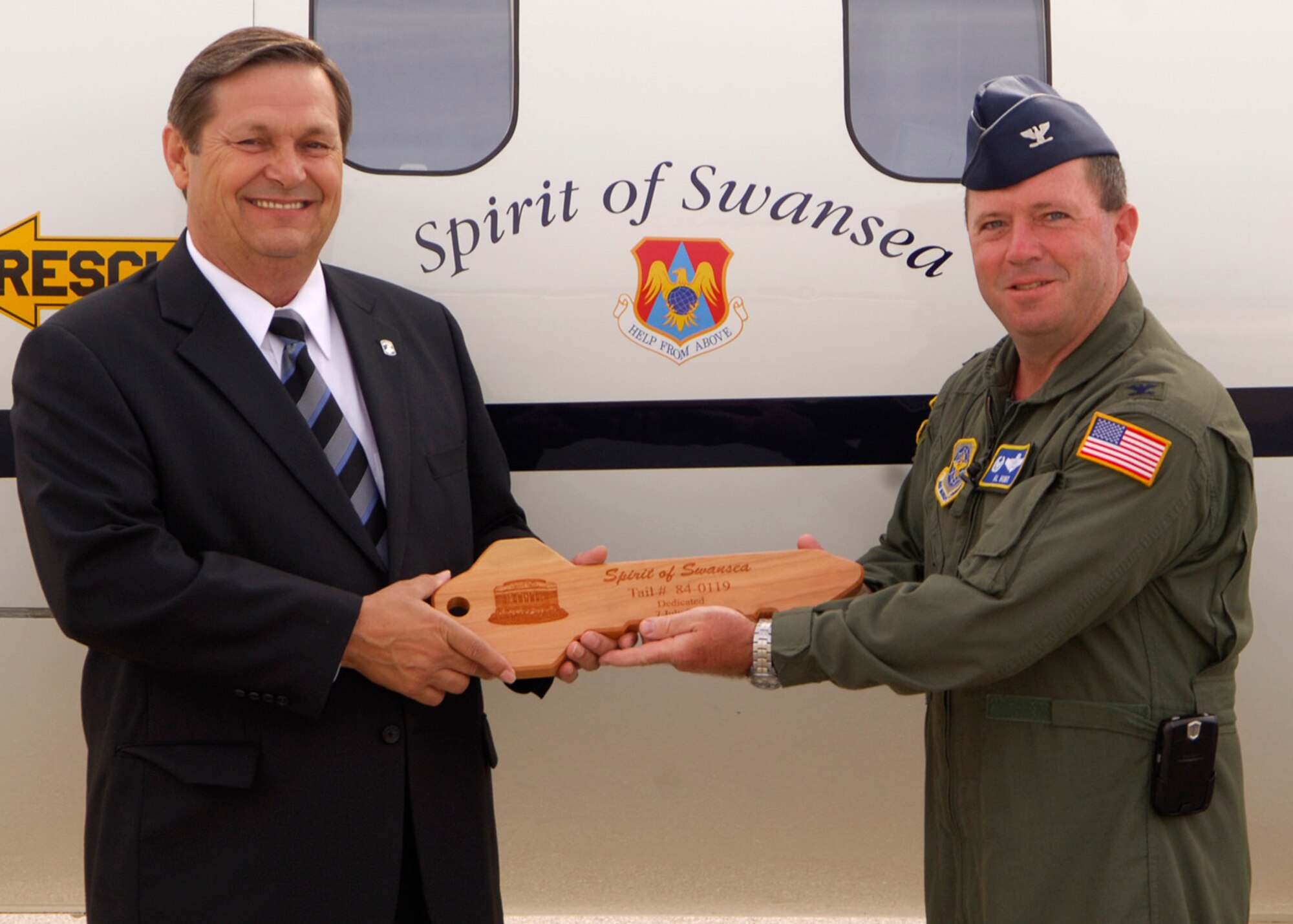 Six C-21 aircraft operated by the 458th Airlift Squadron were named in honor of the communities surrounding Scott Air Force Base last week.  The Aircraft were named the Spirits of Belleville, Swansea, Mascoutah, Lebanon, O'Fallon and Shiloh.  Mayors of the respective communities and other civic leaders attended plane naming ceremonies on Monday and Tuesday  to officially unveil the logos just to the right of the entrance to the planes. All of the visiting mayors expressed great excitement and gratitude for the honors their town received. 375th Airlift Wing commander Col. Al hunt explained the aircraft naming as great way for JTF Scott to show its gratitude for the support it receives from the surrounding communities. The logos on the planes will also be a great way for passengers and flight crews on the planes to start discussions about the continuing support. Pictured (left to right) Lebanon Mayor Scott Abner, Mascoutah Mayor Jerry Daugherty, 375th Airlift Wing commander Colonel Al Hunt, O'Fallon Mayor Gary Graham and Shiloh Mayor Jim Vernier on the flightline just before the official namings of their aircraft.
