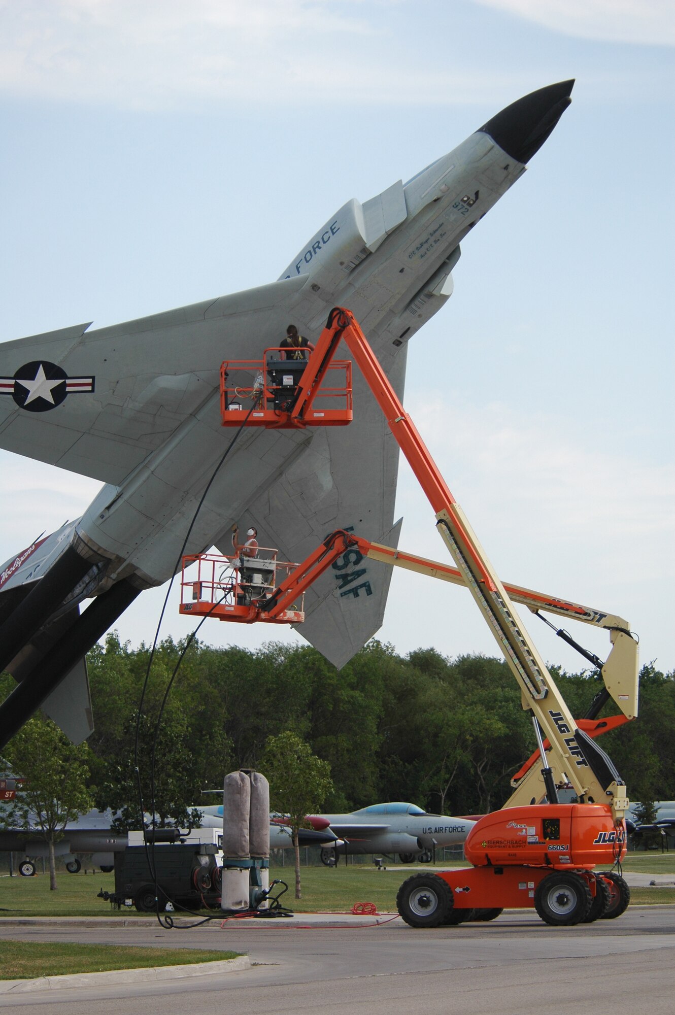 Airmen from the 119th Wing give the F-4 Fighting Phantom static display at the N.D. Air National Guard a fresh coat of paint in August 2007.
