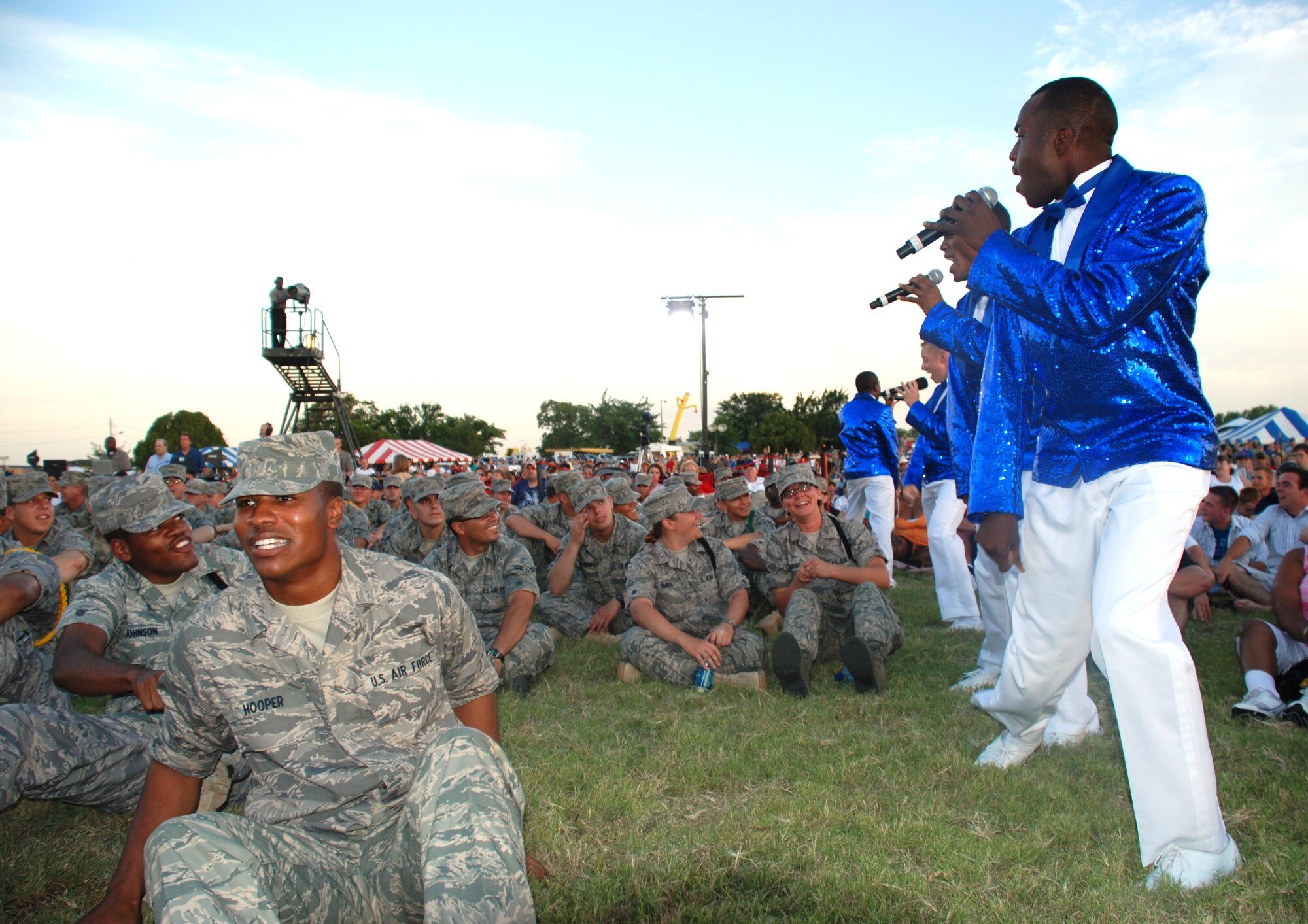 Tops in Blue members sing to Sheppard Airmen in Training at Freedom Fest 2008 July 4. Tops in Blue was one of many events and performers Team Sheppard were treated to at the event. Others included family-friendly games, live music from local bands and a fireworks show. U.S. Air Force photo/Airman 1st Class Jacob Corbin)