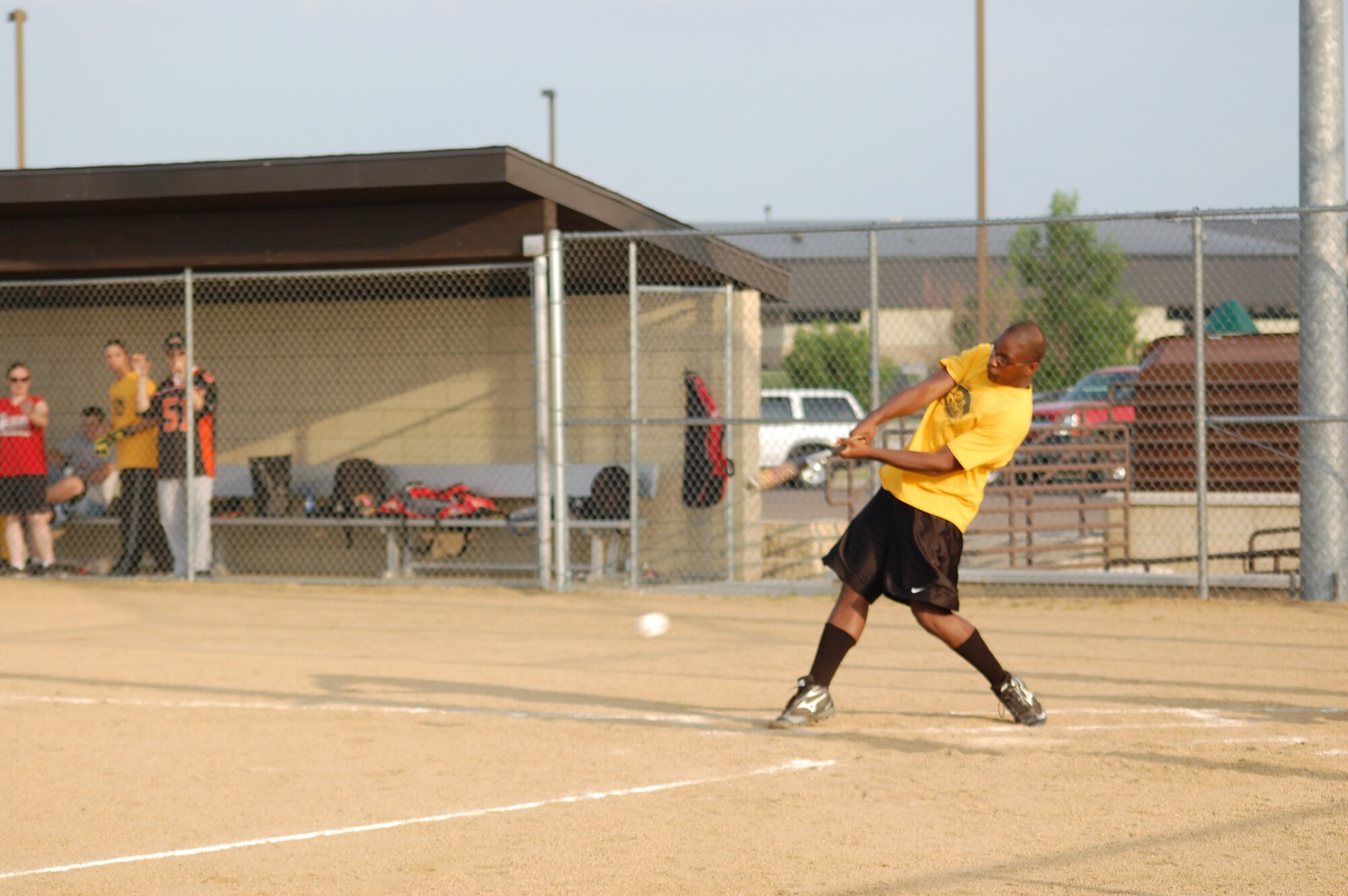 Airman 1st Class Hassan Johnson, 341st Comptroller Squadron, swings during a softball game July 7. Team MMXS defeated Team FSS with a 17 to 2 win. (U.S. Air Force photo/Airman 1st Class Emerald Ralston)