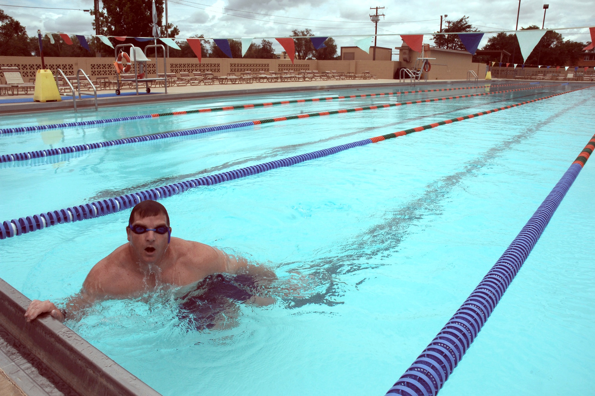 CANNON AIR FORCE, BASE, N.M. -- Capt. David Brandt, 73rd Special Operations Squadron, completes a 5,000-meter swim July 8 at Liberty Pool. Capt. Brandt swam 50 labs when challenged to swim in support of the squadron's Habitat for Humanity program. (U.S. Air Force photo by Airman 1st Class Evelyn Chavez )