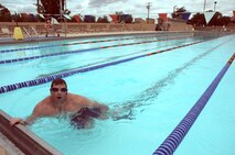 CANNON AIR FORCE, BASE, N.M. -- Capt. David Brandt, 73rd Special Operations Squadron, completes a 5,000-meter swim July 8 at Liberty Pool. Capt. Brandt swam 50 labs when challenged to swim in support of the squadron's Habitat for Humanity program. (U.S. Air Force photo by Airman 1st Class Evelyn Chavez )