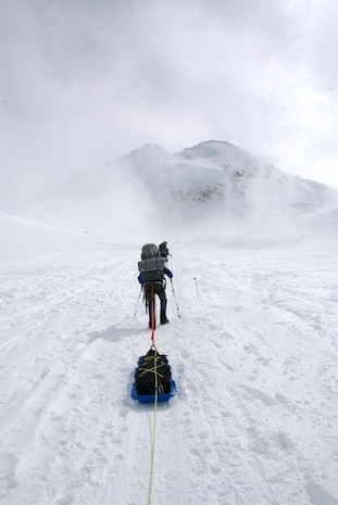 A member of the Seven Summits Challenge hauls his gear up the side of Mt. McKinley, Alaska. Mt. McKinley is the highest peak in North America and a six-man Air Force team climbed the mountain in June. (Courtesy photo)