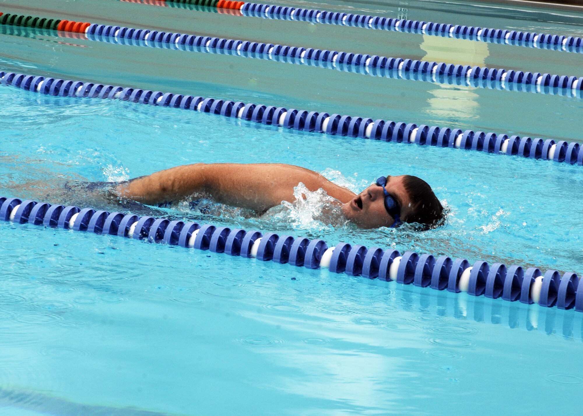 CANNON AIR FORCE, BASE, N.M. -- Capt. David Brandt, 73rd Special Operations Squadron, swims the final lap of 50 July 8 at Liberty Pool. Capt. Brandt swam 5,000 meters when challenged to swim in support of the squadron's Habitat for Humanity program. (U.S. Air Force photo by Airman 1st Class Evelyn Chavez )