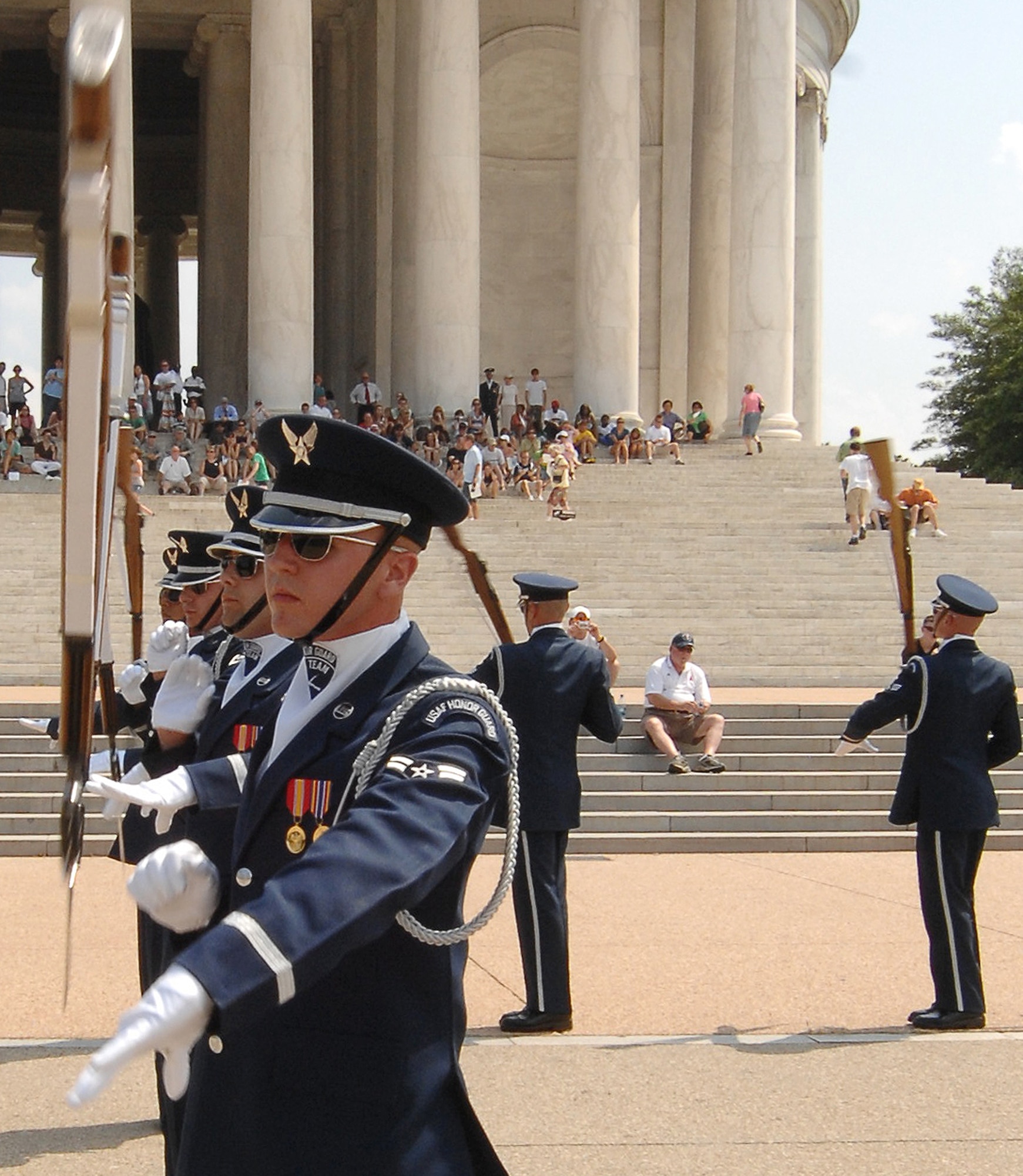 Airman 1st Class Aaron Fowler, U.S. Honor Guard Drill Team, spins a “side double” as part of the team's Summer Drill Series July 8 at the Jefferson Memorial in Washington. The team will perform around the National Capitol Region until July 29. For more information about the 2008 performances, logon to www.honorguard.af.mil/drillteam/. (U.S Air Force photo by Senior Airman Alexandre Montes)