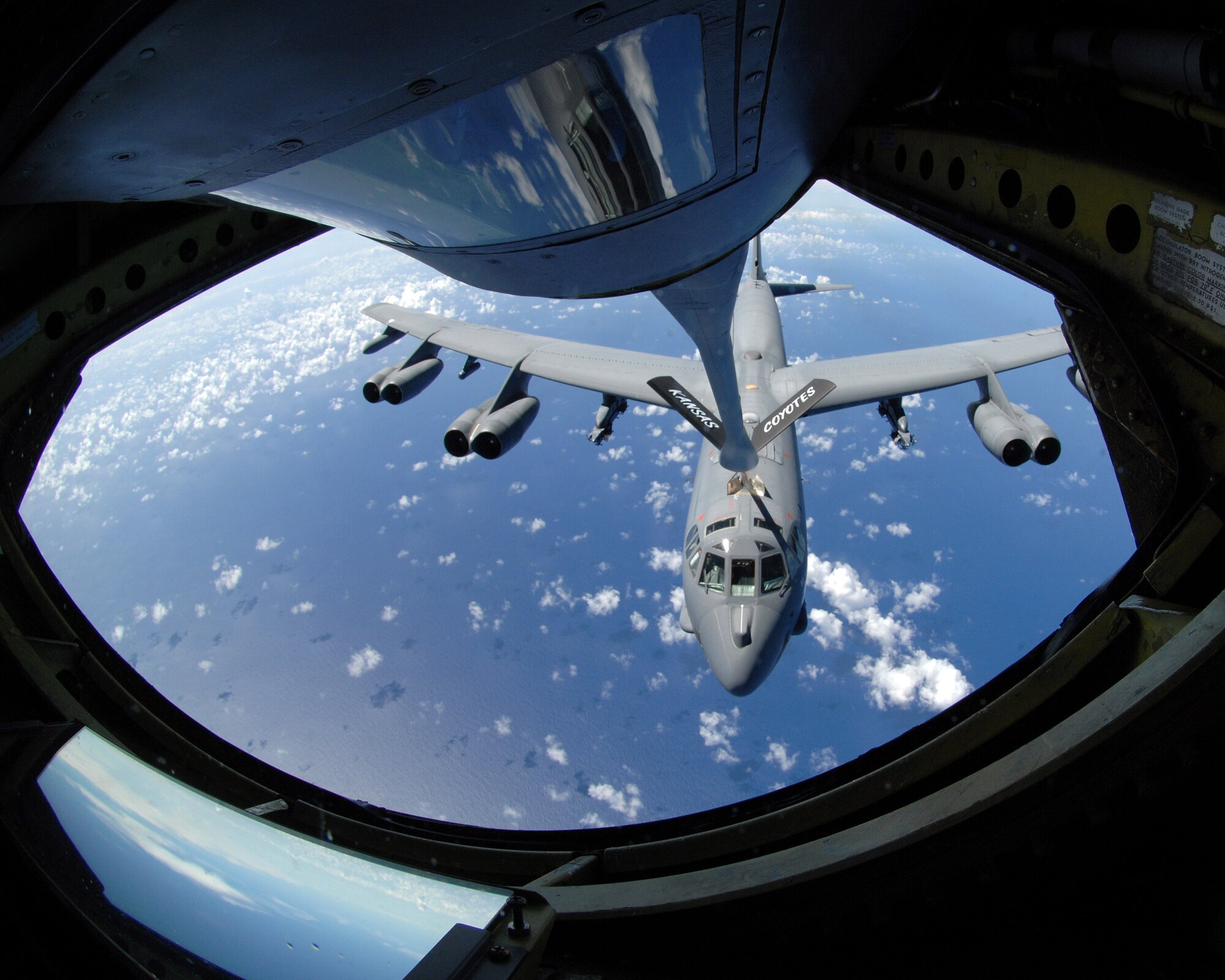 A U.S. Air Force KC-135R Stratotanker refuels a B-52H Stratofortress over the Pacific Ocean June 26. The KC-135R from the 190th Air Refueling Wing at Forbes Field, Kan., can hold up to 200,000 pounds of fuel. Nearly all internal fuel can be pumped through the tanker's flying boom, which is the KC-135's primary fuel transfer method. A special shuttlecock-shaped drogue, attached to and trailing behind the flying boom, may be used to refuel aircraft fitted with probes. (U.S. Air Force photo by Airman 1st Class Courtney Witt)