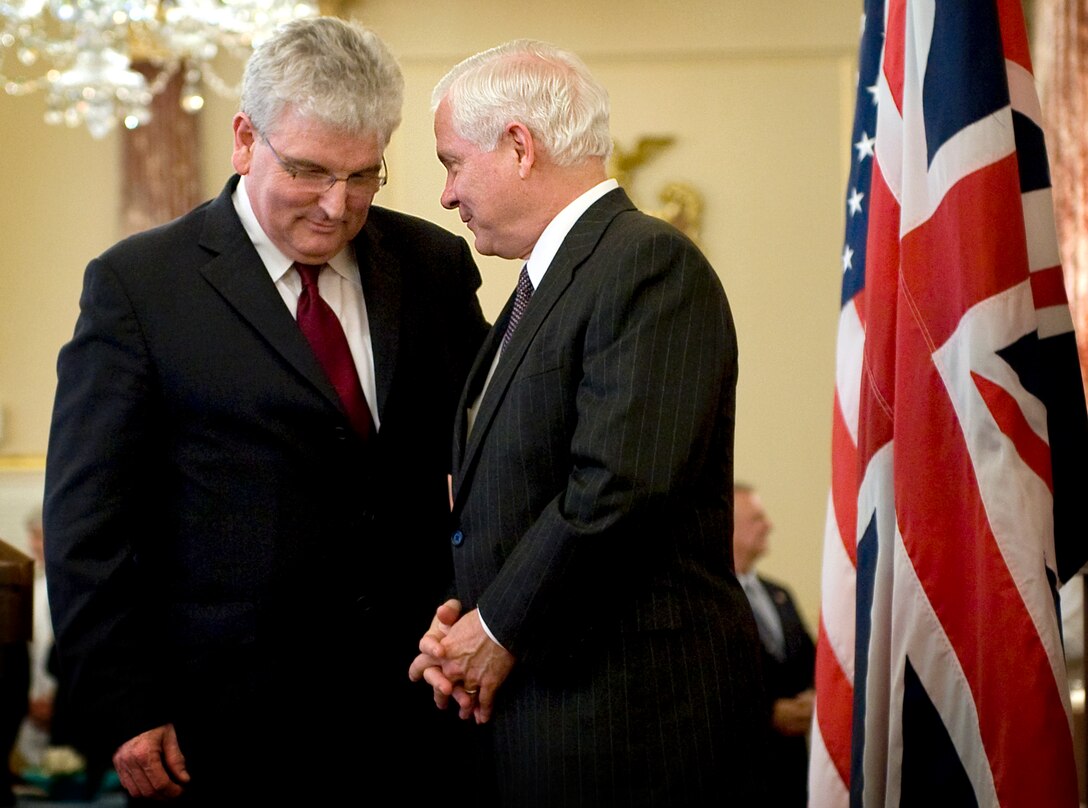 U.S. Defense Secretary Robert M. Gates, right, speaks with United Kingdom Defense Minister Des Browne during a reception commemorating the 50th anniversary of the Mutual Defense Agreement between the United States and the U.K. at the State Department in Washington, D.C., July 9, 2008.  