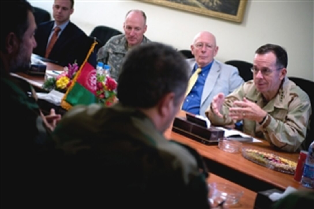 U.S. Navy Adm. Mike Mullen, right, chairman of the Joint Chiefs of Staff, meets with Besmullah Khan, chief of staff of the Afghan National Army, in Kabul, Afghanistan, July 10, 2008. Mullen is on a six-day tour of the region to visit troops and host a USO contingent.