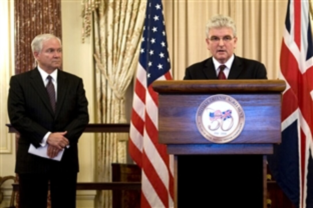 United Kingdom Defense Minister Des Browne addresses the audience during a reception hosted by Defense Secretary Robert M. Gates, left, commemorating the 50th anniversary of the Mutual Defense Agreement between the United States and the United Kingdom at the State Department, Washington, D.C., July 9, 2008.  