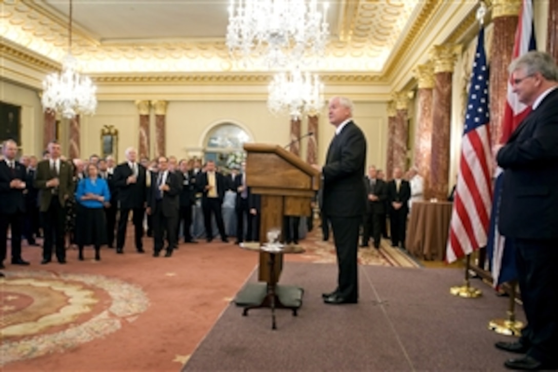 Defense Secretary Robert M. Gates addresses the audience during a reception commemorating the 50th anniversary of the Mutual Defense Agreement between the United States and the United Kingdom with United Kingdom Defense Minister Desmond Browne, right, at the State Department, Washington, D.C., July 9, 2008. 
