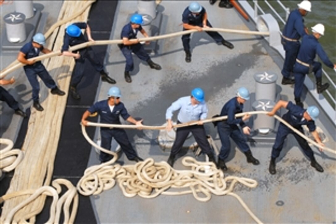 U.S. Navy sailors from the sea-and-anchor detail of the amphibious dock landing ship USS Carter Hall pull in lines during the Iwo Jima Expeditionary Strike Group composite unit training exercise, Atlantic Ocean, July 8, 2008. The exercise provides a realistic training environment to ensure the strike group is capable and ready for its upcoming deployment. 