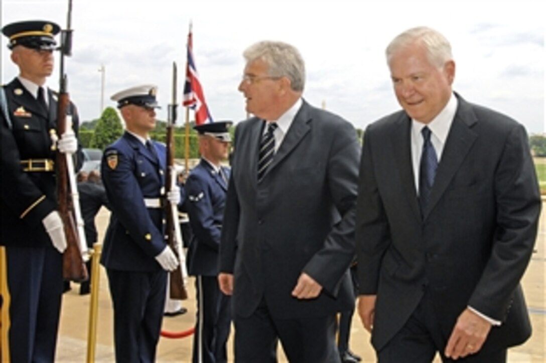 U.S. Defense Secretary Robert M. Gates escorts British Secretary of State for Defense Desmond Browne through an honor cordon into the Pentagon, July 10, 2008. The two defense leaders will  discuss a range of bilateral security issues. 